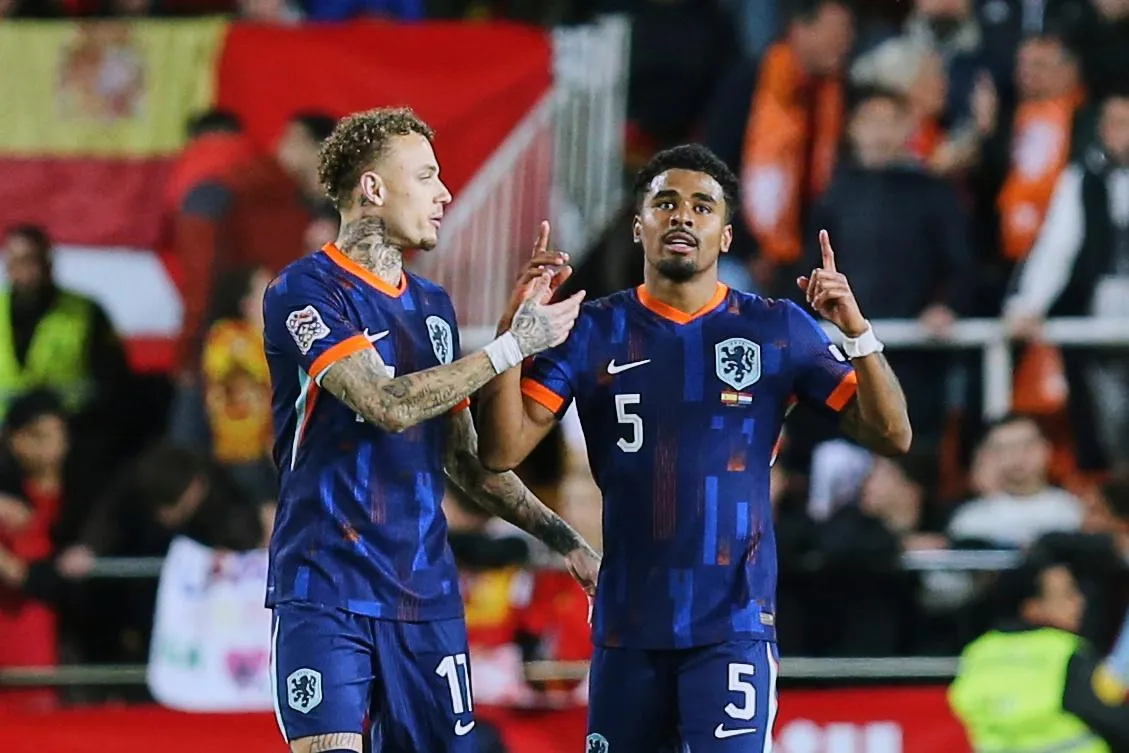 Netherlands' Noa Lang, left, congratulates his teammate Ian Maatsen after scoring his side second goal.