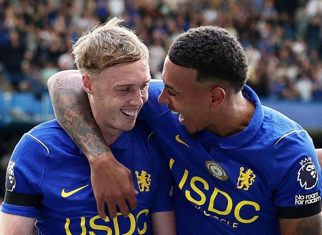 Cole Palmer celebrates scoring with Morgan Rogers