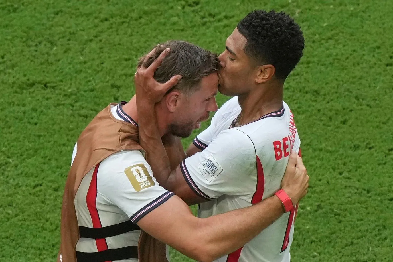 England's Jude Bellingham (right) kisses Jordan Henderson on the head as he celebrates scoring their sixth goal.