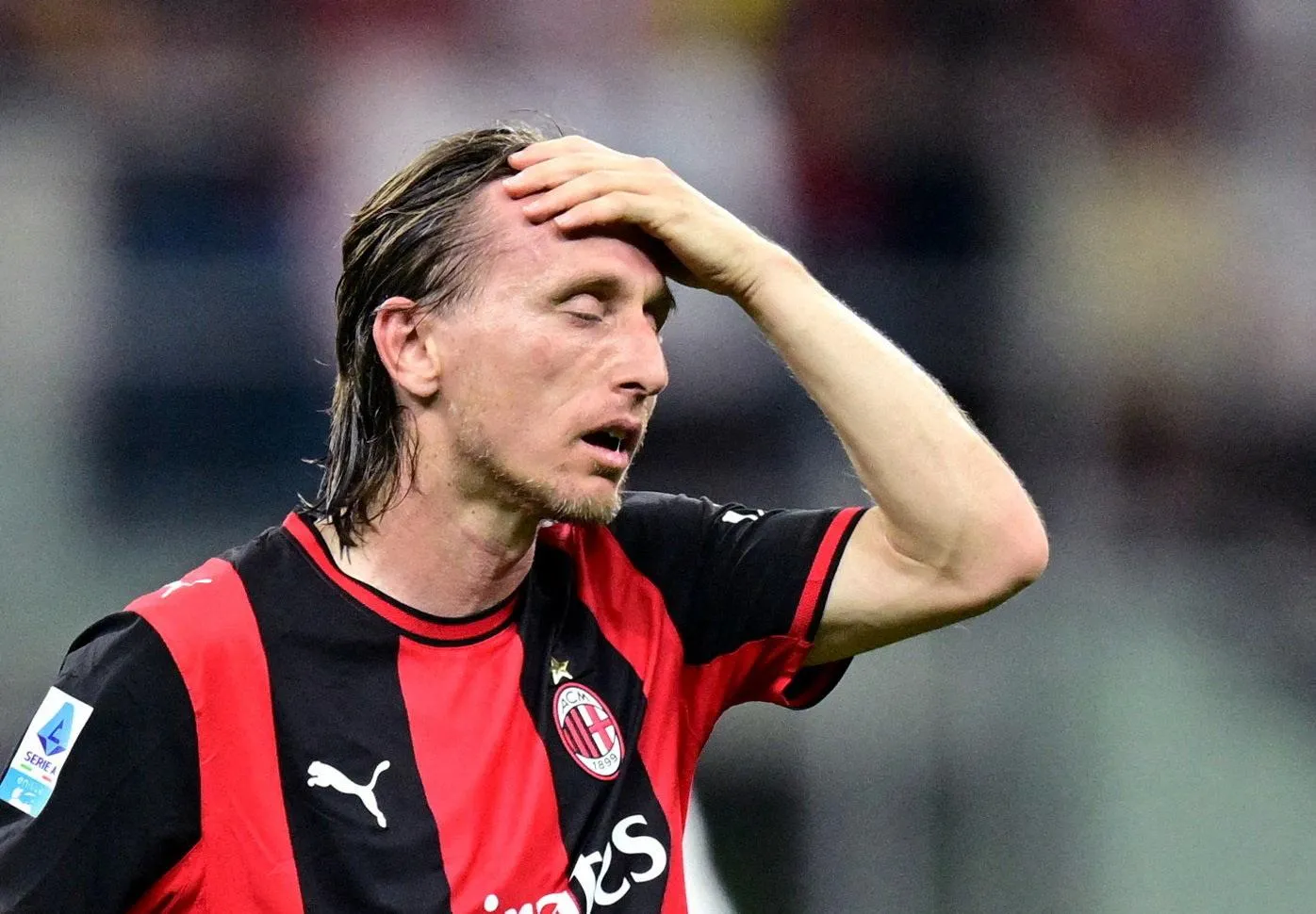 Milan’s Luka Modric looks dejected.