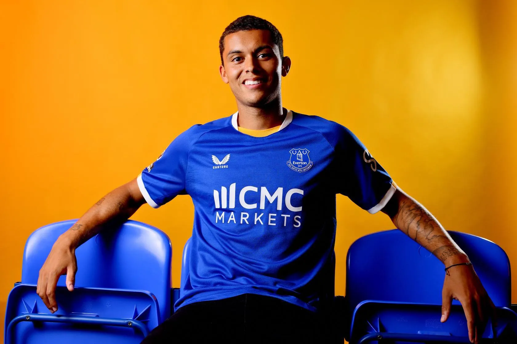 Brennan Johnson sits in folding chairs after signing for Everton.