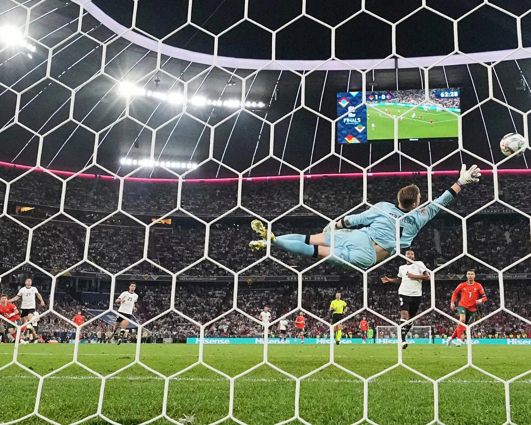 Francisco Conceiçao (bottom left) beats Marc-André ter Stegen with a long-range strike.