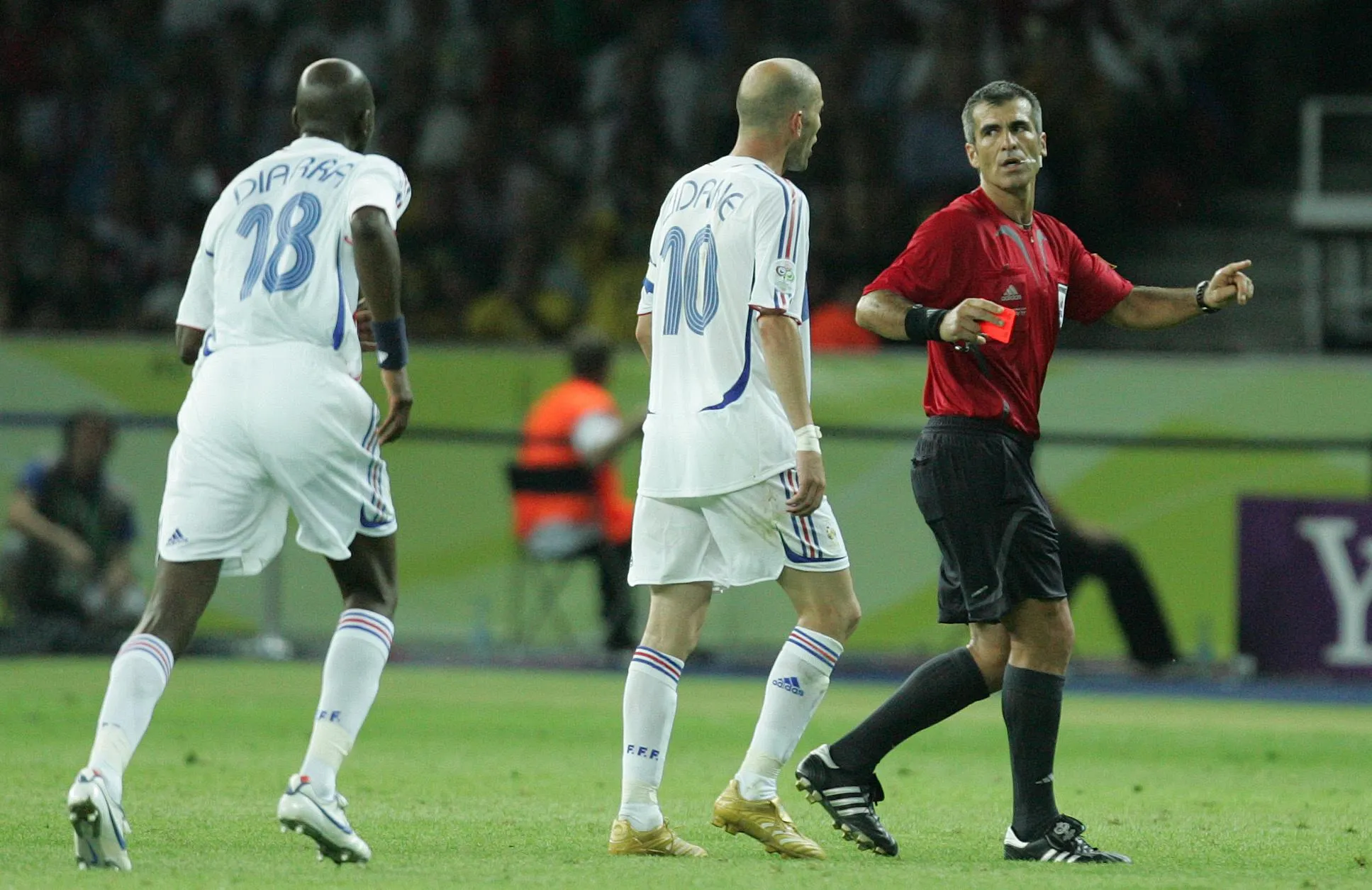 Zinedine Zidane talks to the referee Horazio Elizondo after being sent off in the 2006 World Cup final, as Alou Diarra approaches