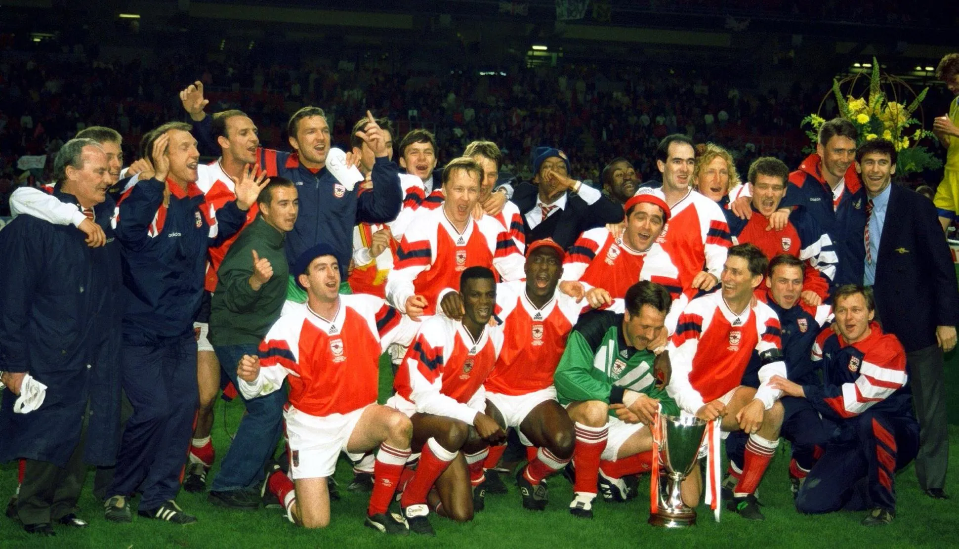 The Arsenal players line up with the trophy.