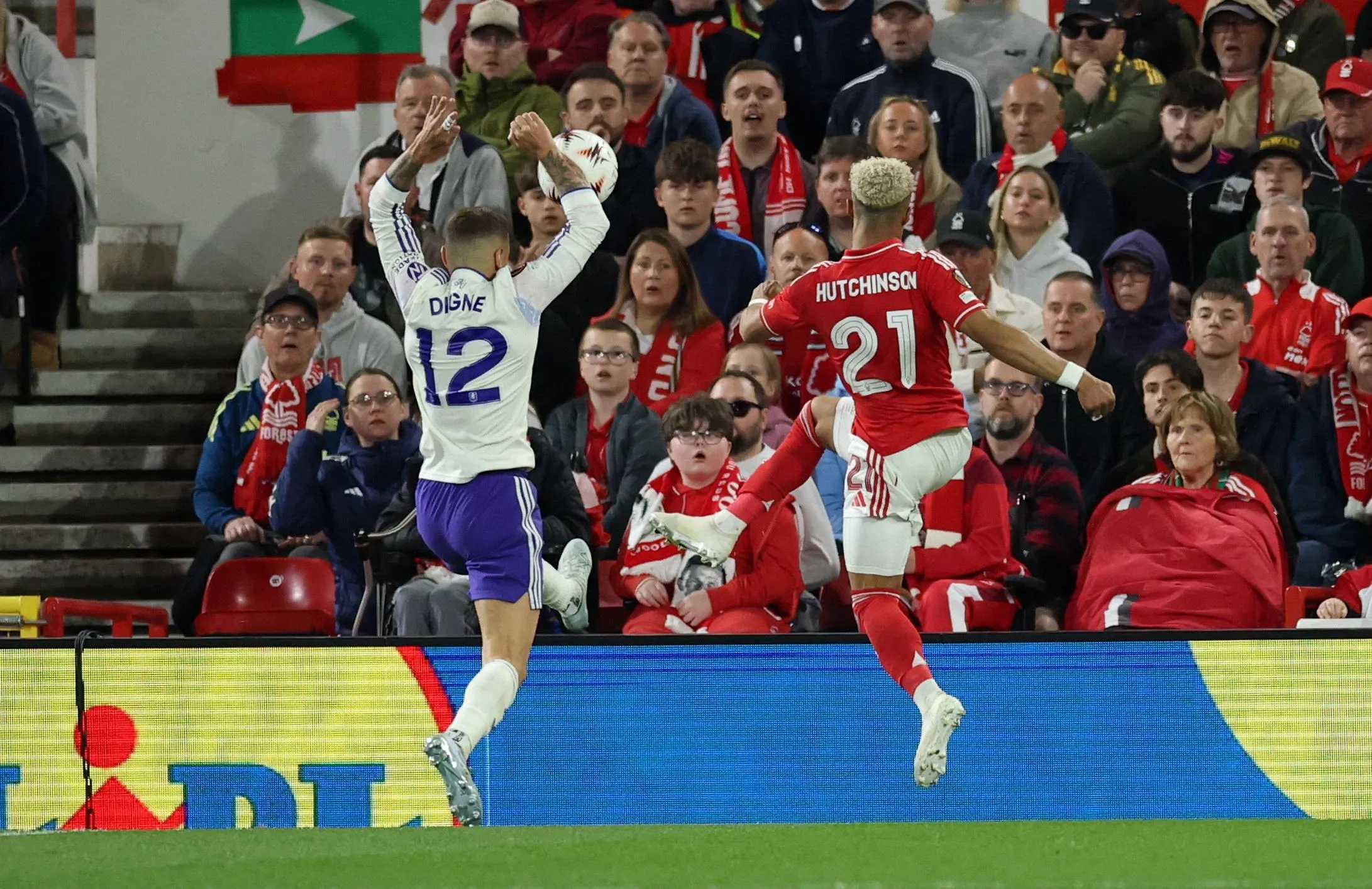 Aston Villa's Lucas Digne handballs to concede a penalty after Nottingham Forest's Omari Hutchinson crosses the ball.