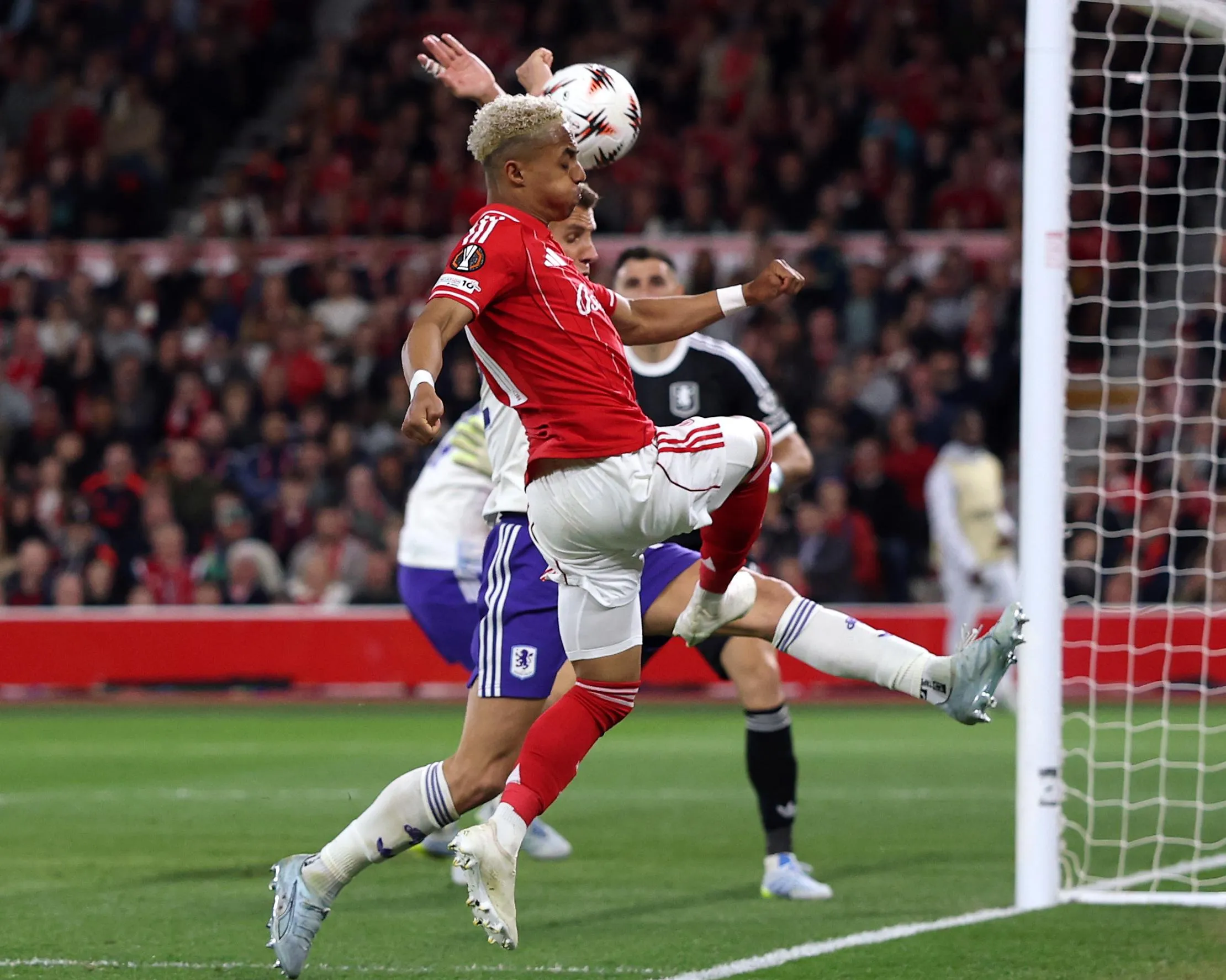 Omari Hutchinson’s cross clatters into the arms of Aston Villa’s Lucas Digne which led to a penalty being awarded to Nottingham Forest.