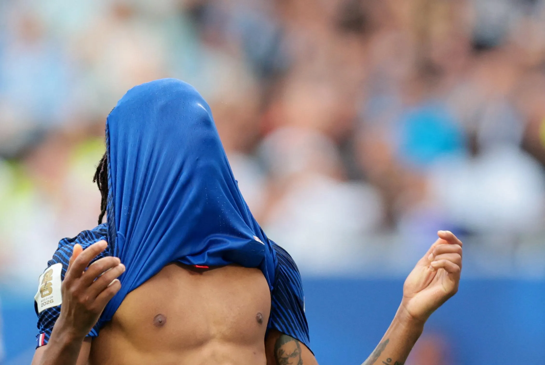 France's Michael Olise reacts after missing a chance to score.