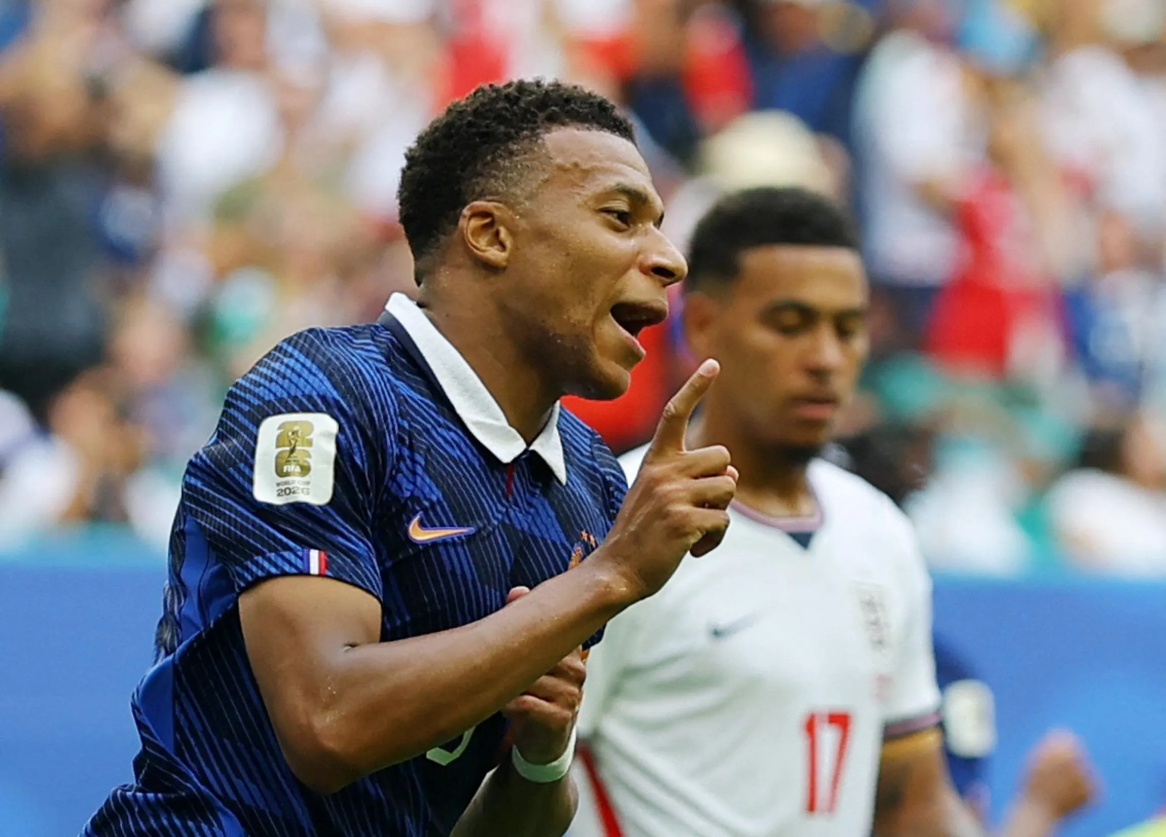 France's Kylian Mbappe celebrates scoring their third goal.