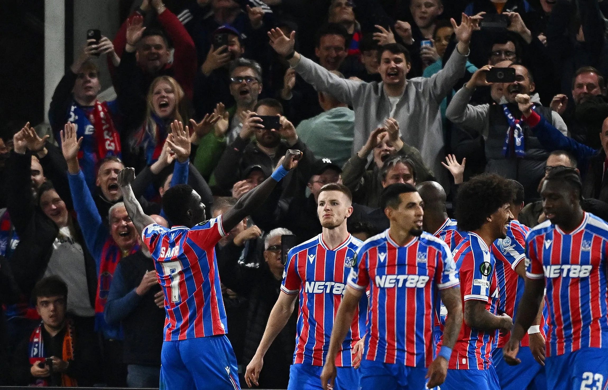 Crystal Palace's Ismaila Sarr celebrates in front of the fans