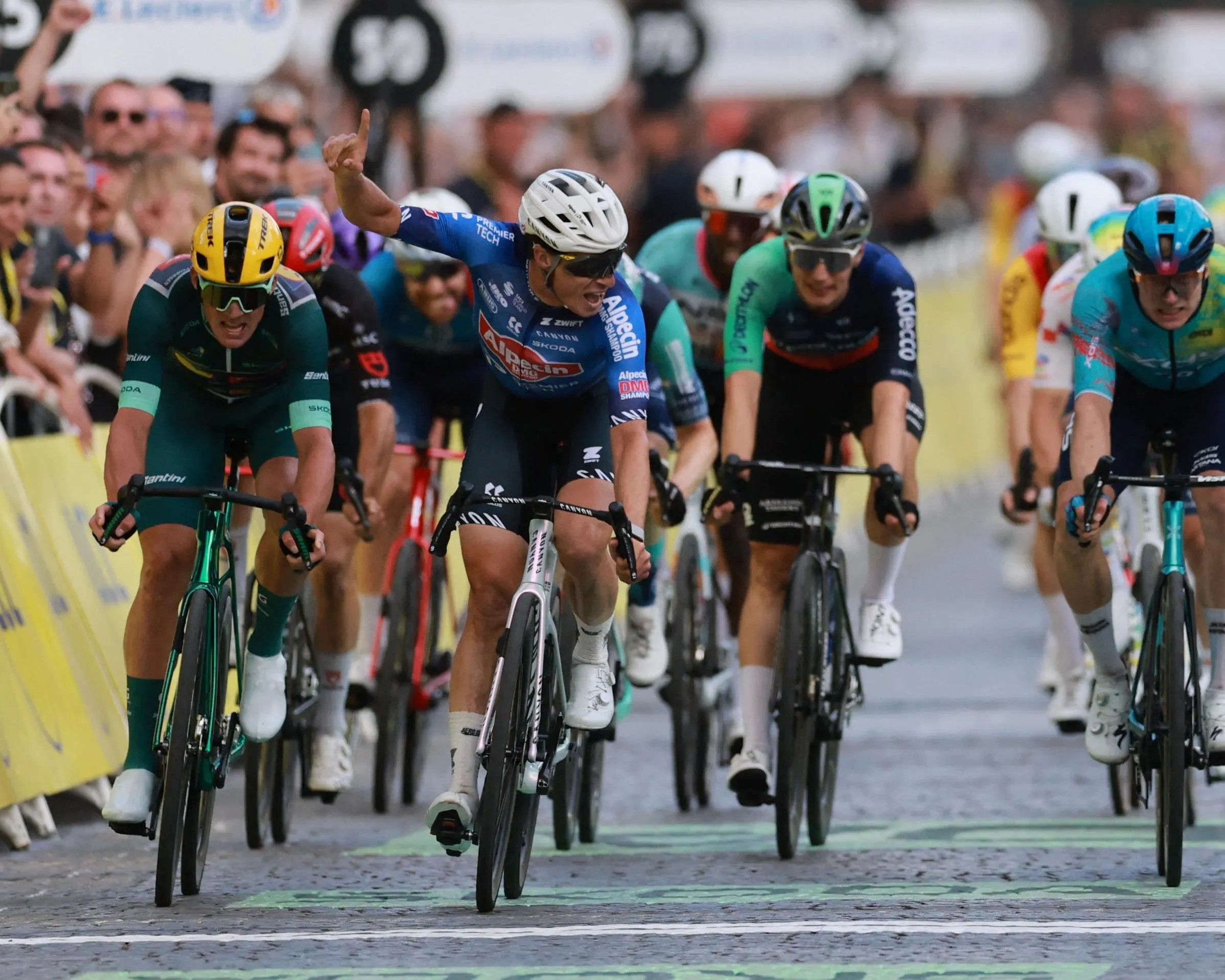 Premier Tech's Mathieu Van Der Poel celebrates as he crosses the finish line to win stage 21.