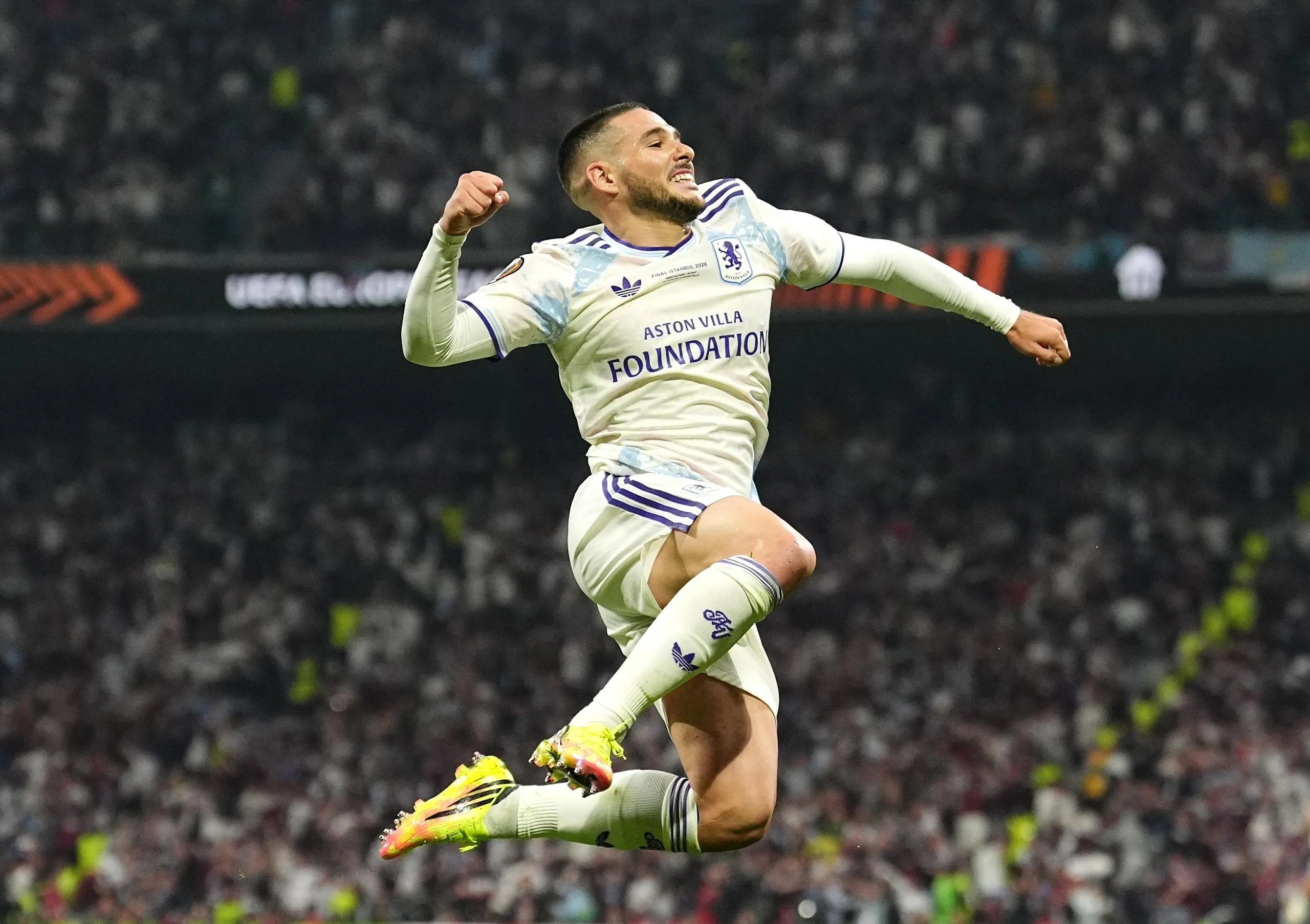 Emi Buendía leaps up and punches the air after scoring Villa’s second goal