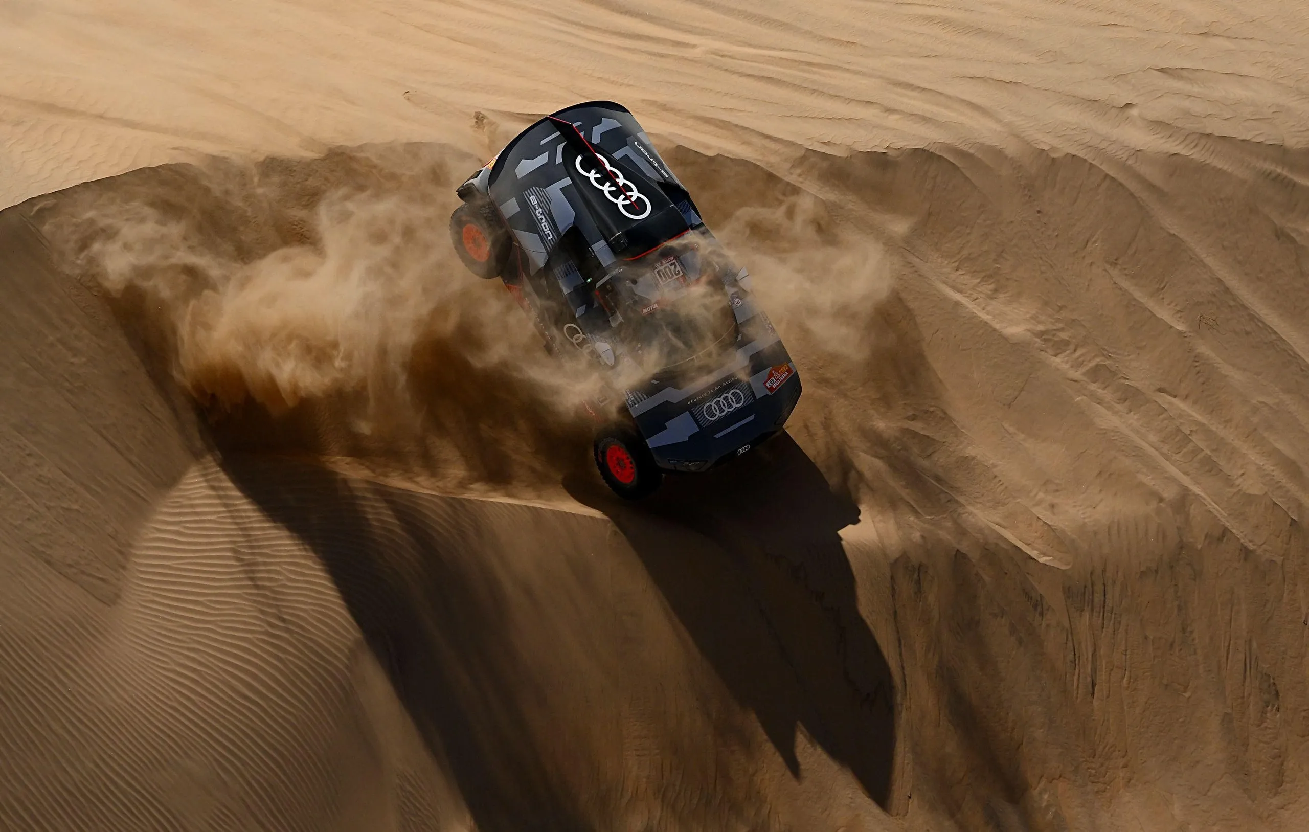Audi’s driver Stephane Peterhansel and his co-driver Edouard Boulanger in their Audi RS Q E-Ttron compete during Stage 11.