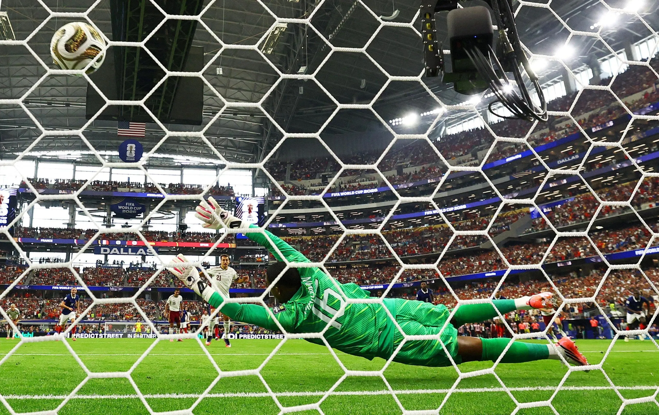 Spain’s Mikel Oyarzabal scores their first goal from the penalty spot.