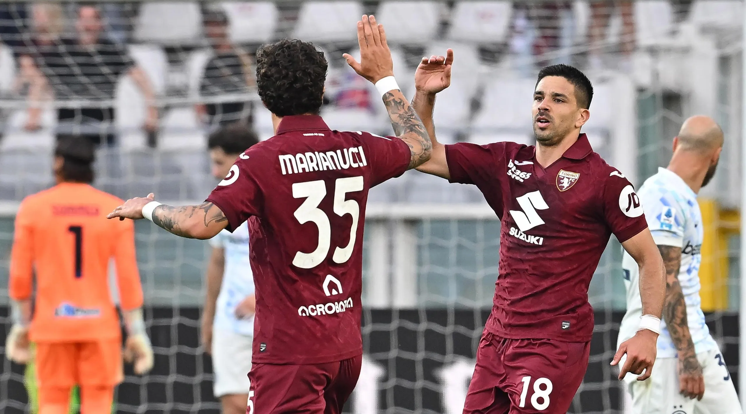 Torino forward Giovanni Simeone celebrates with defender Luca Marianucci