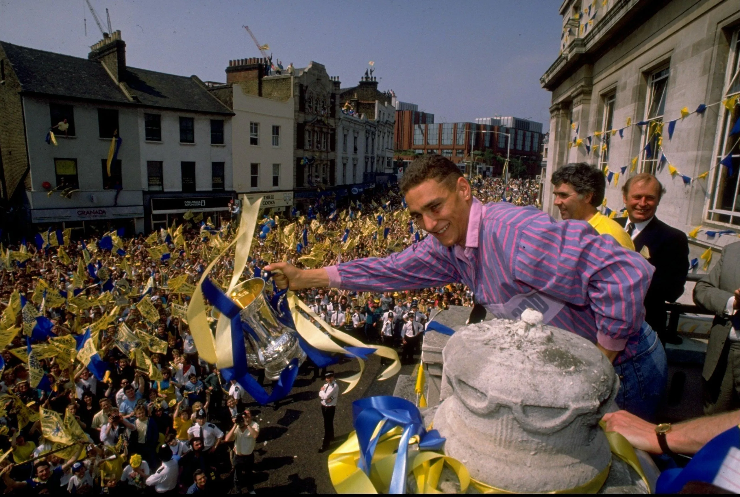 Vinnie Jones shows the trophy to supporters after Wimbledon’s win in 1988