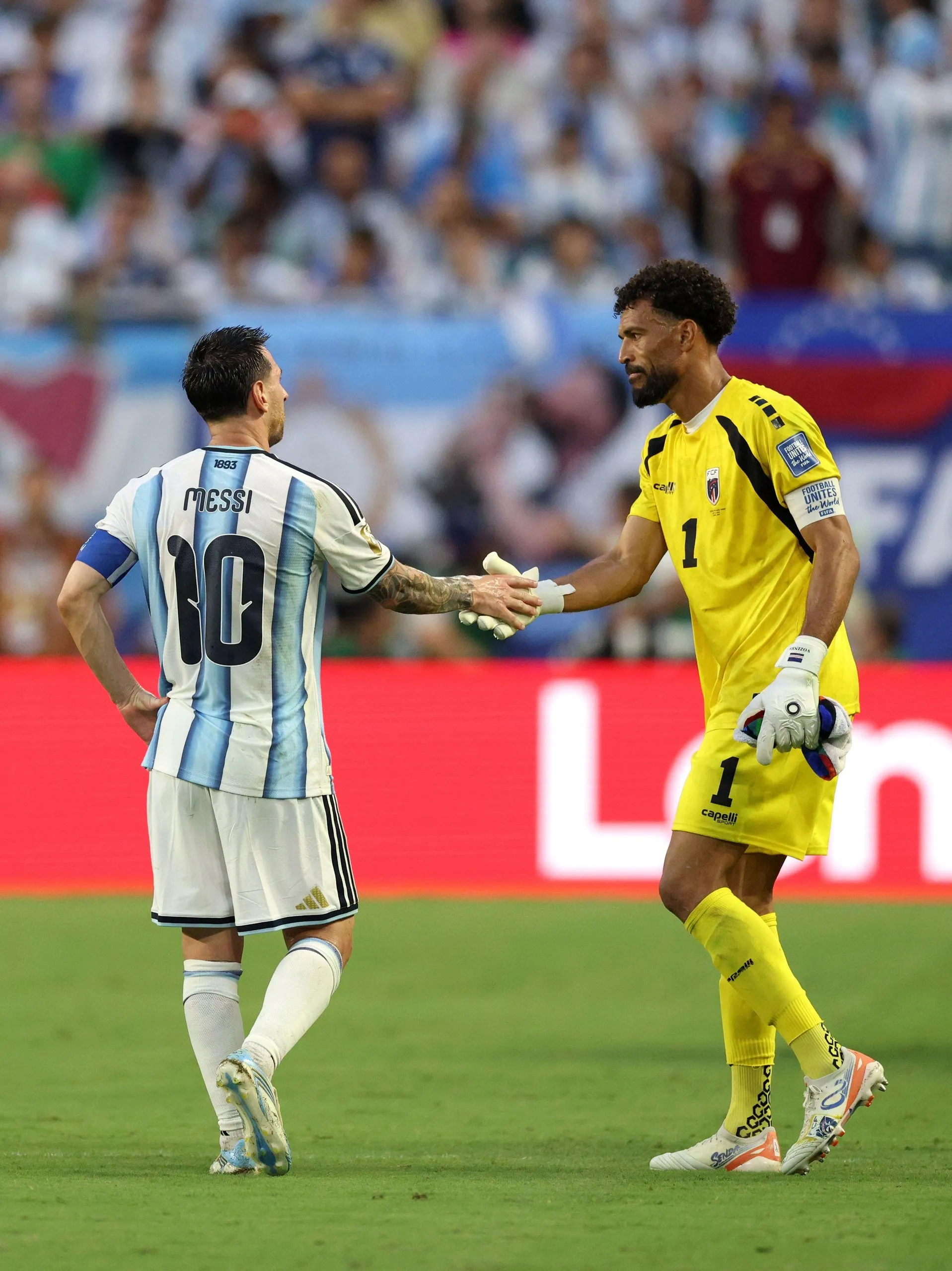 Cape Verde’s goalkeeper Vozinha shakes hands with Lionel Messi