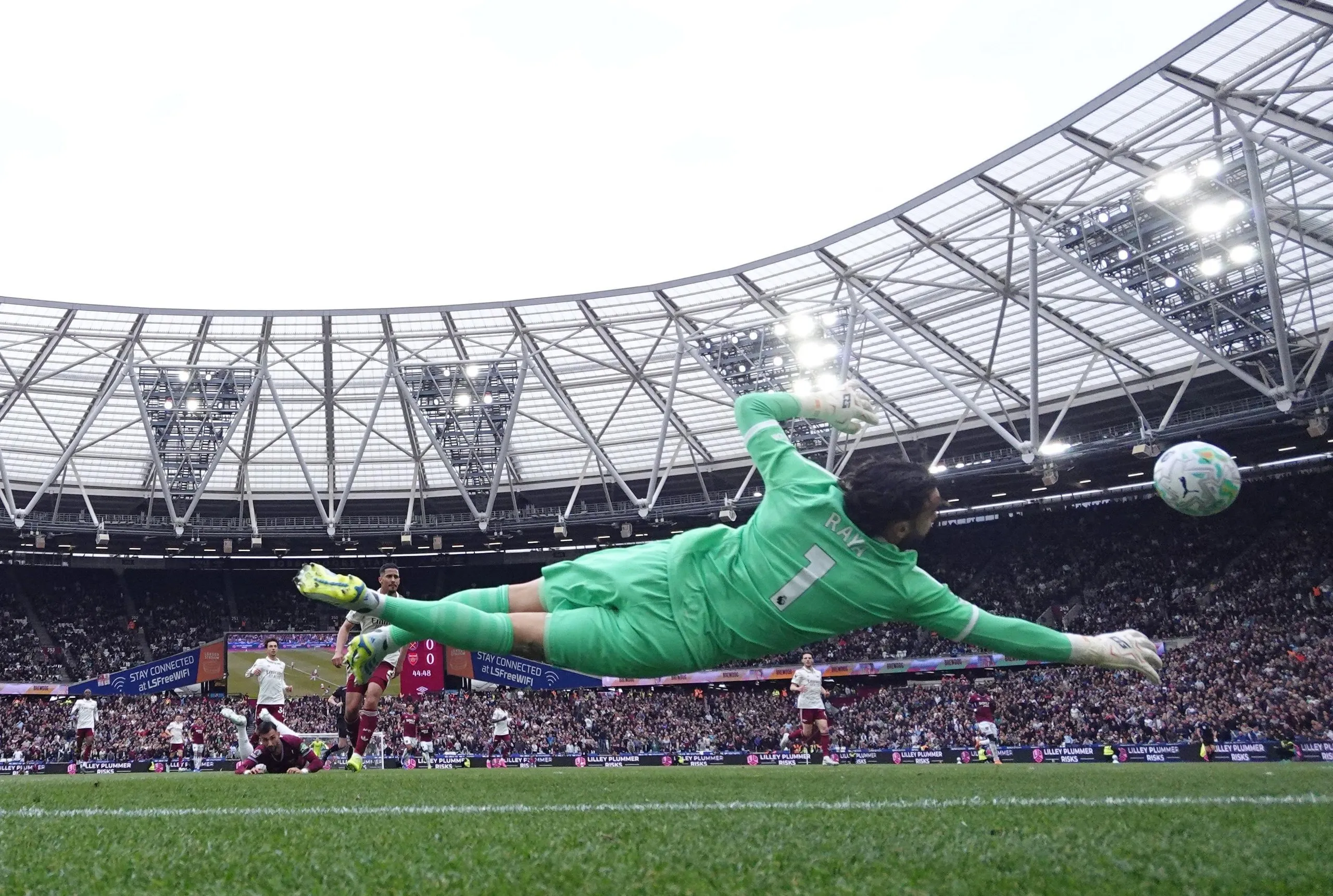 David Raya saves a header from West Ham United’s Taty Castellanos.