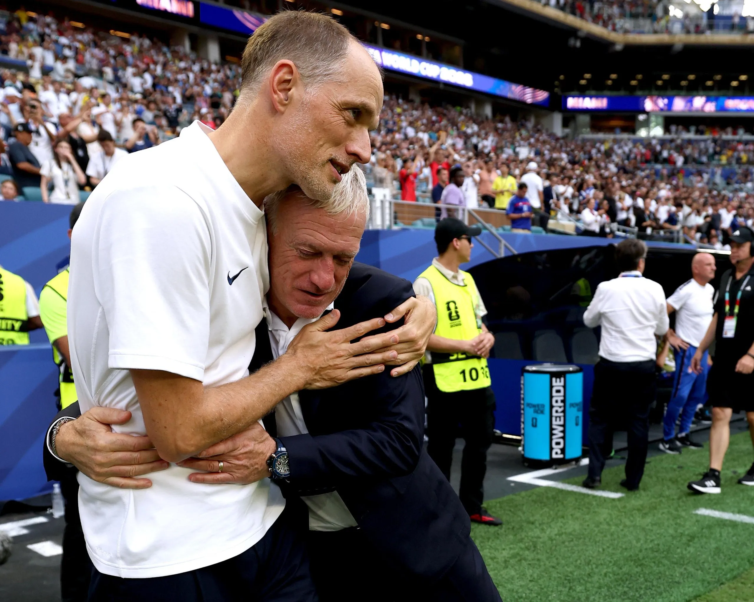 England manager Thomas Tuchel and Didier Deschamps, head coach of France, hug after the final whistle.