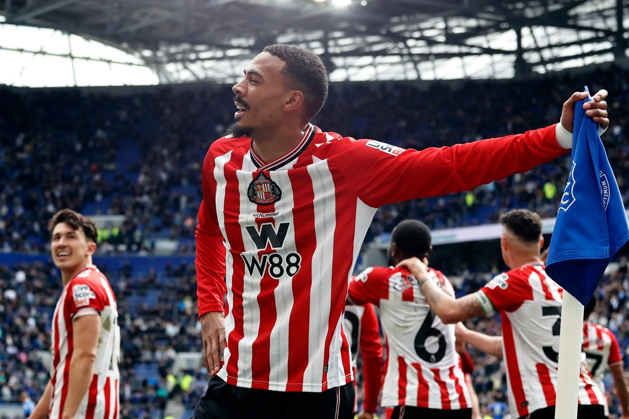 Wilson Isidor leans on the corner flag after scoring Sunderland’s third goal at the death