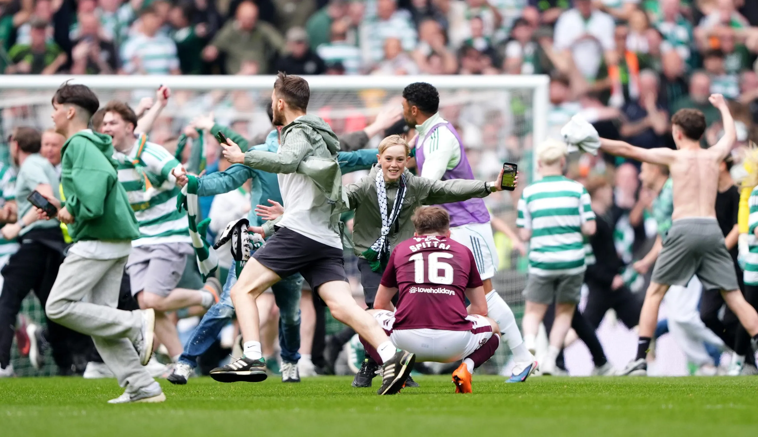 Celtic fans celebrate their sides victory over Hearts.