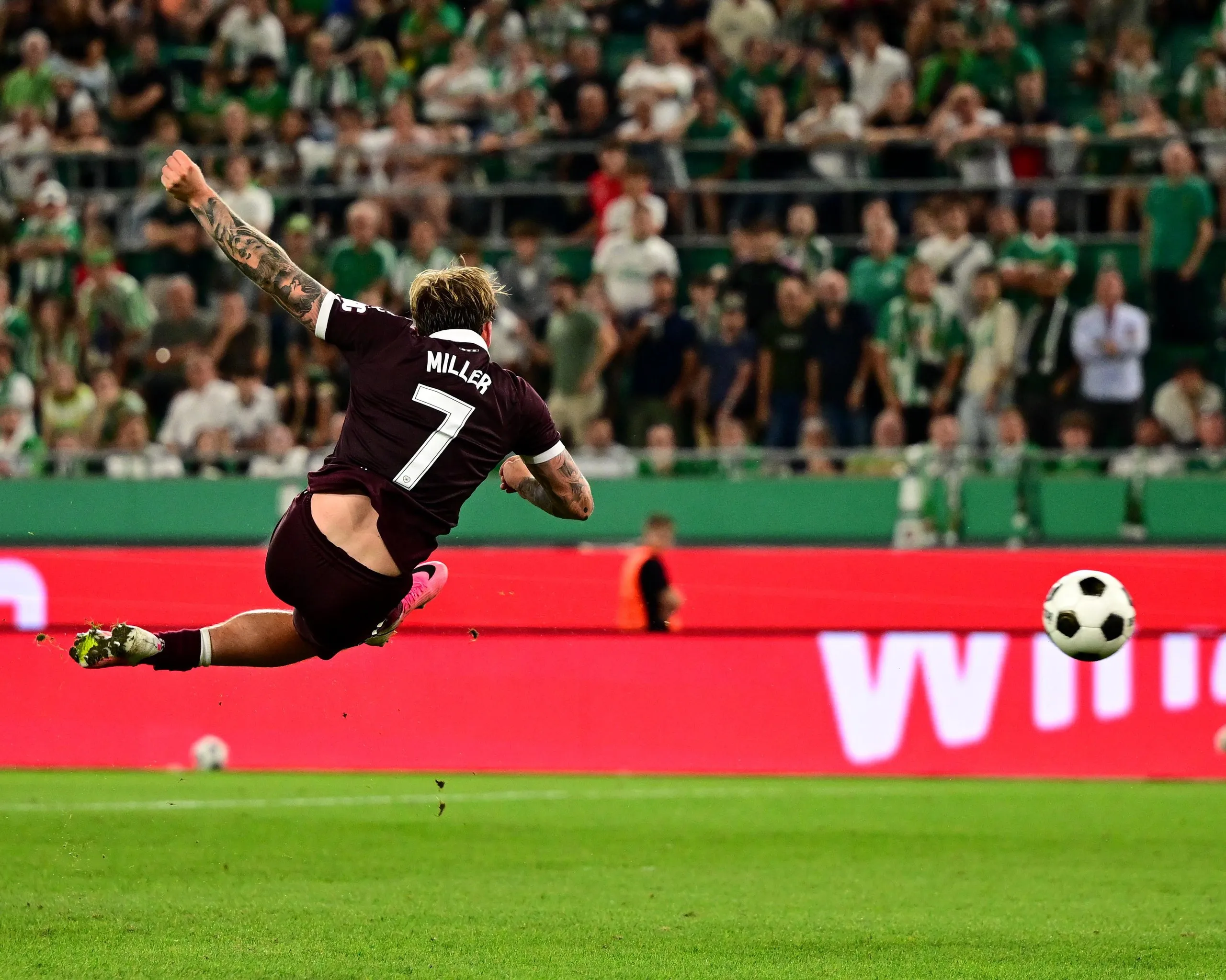 Calvin Miller finishes acrobatically to put Hearts ahead in extra time.