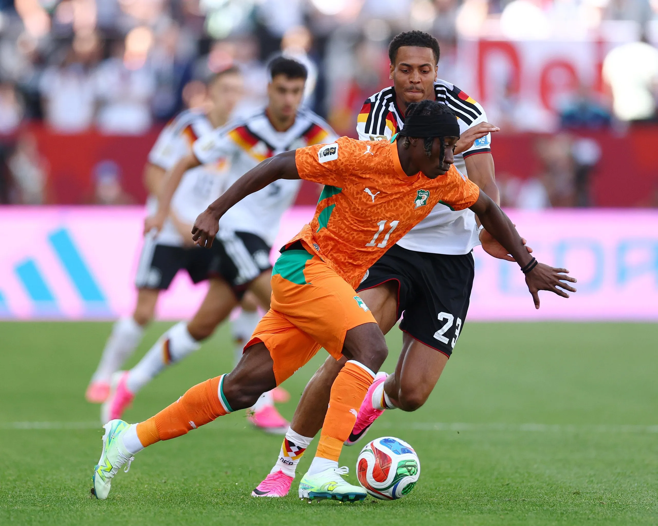 The Côte d’Ivoire winger Yan Diomande runs past the Germany midfielder Felix Nmecha during their 2026 World Cup group stage match in Toronto.