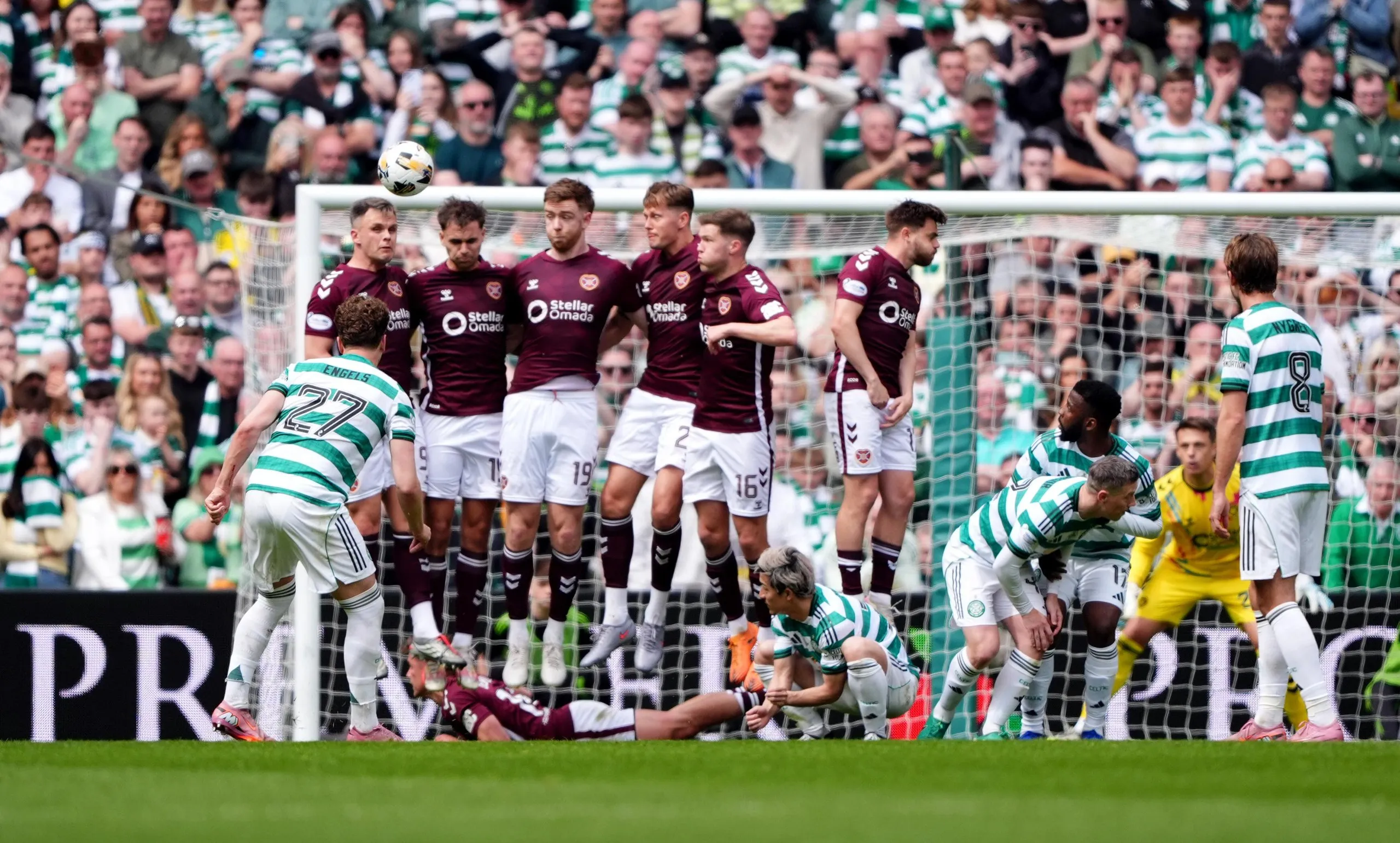 Celtic’s Arne Engels curls his free-kick over the wall and wide of the Hearts goal.