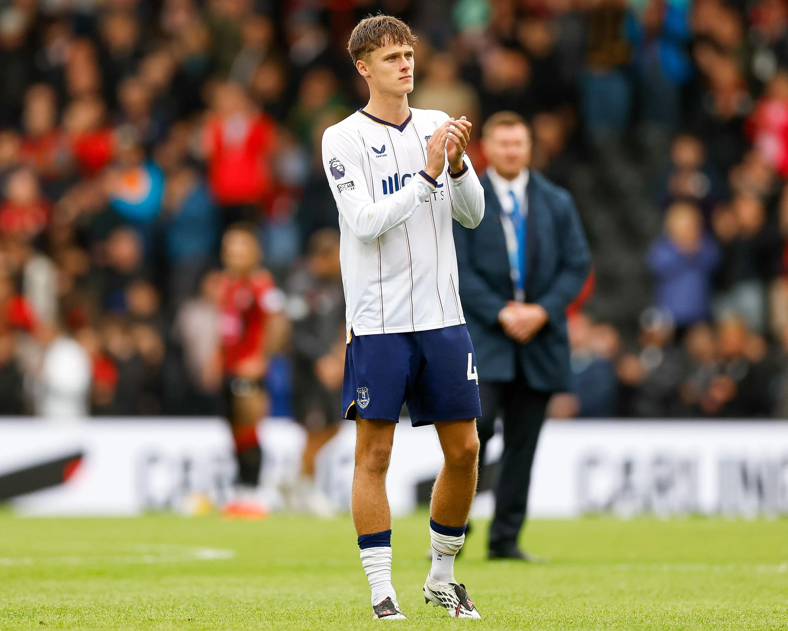 Harrison Armstrong applauds the fans who sang for him during the Premier League match between Bournemouth and Everton