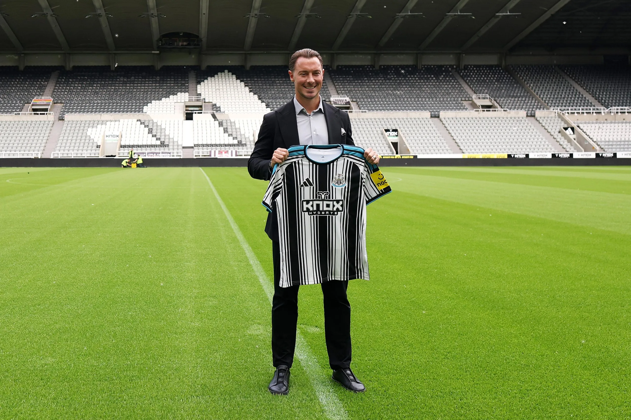 Matthias Jaissle poses with the Newcastle home shirt during his unveiling as the club’s new manager on the pitch at St James’ Park.