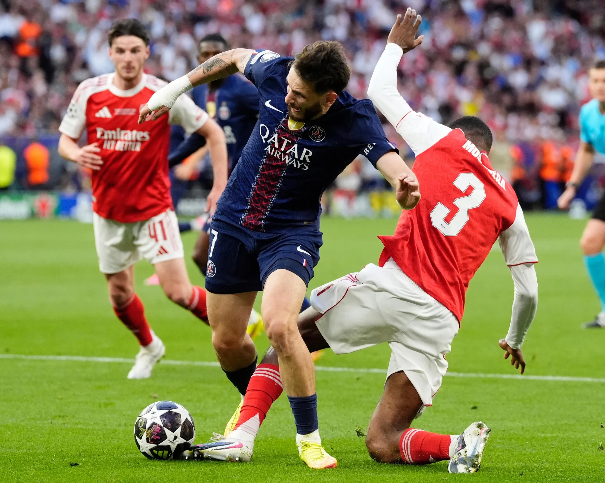 Paris Saint-Germain’s Khvicha Kvaratskhelia (left) is fouled by Arsenal’s Cristhian Mosquera resulting in a penalty
