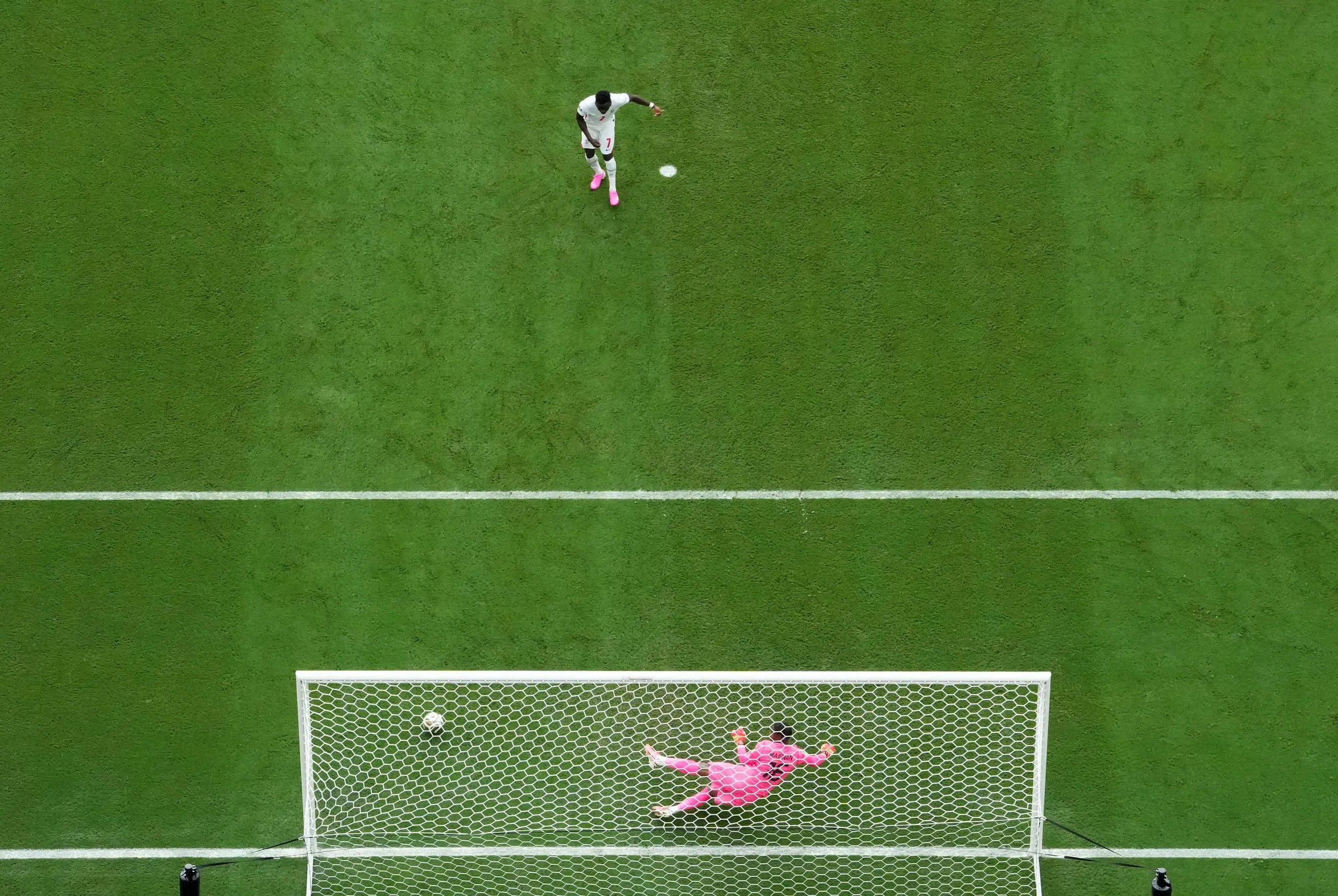 England's Bukayo Saka scores their fifth goal from the penalty spot.
