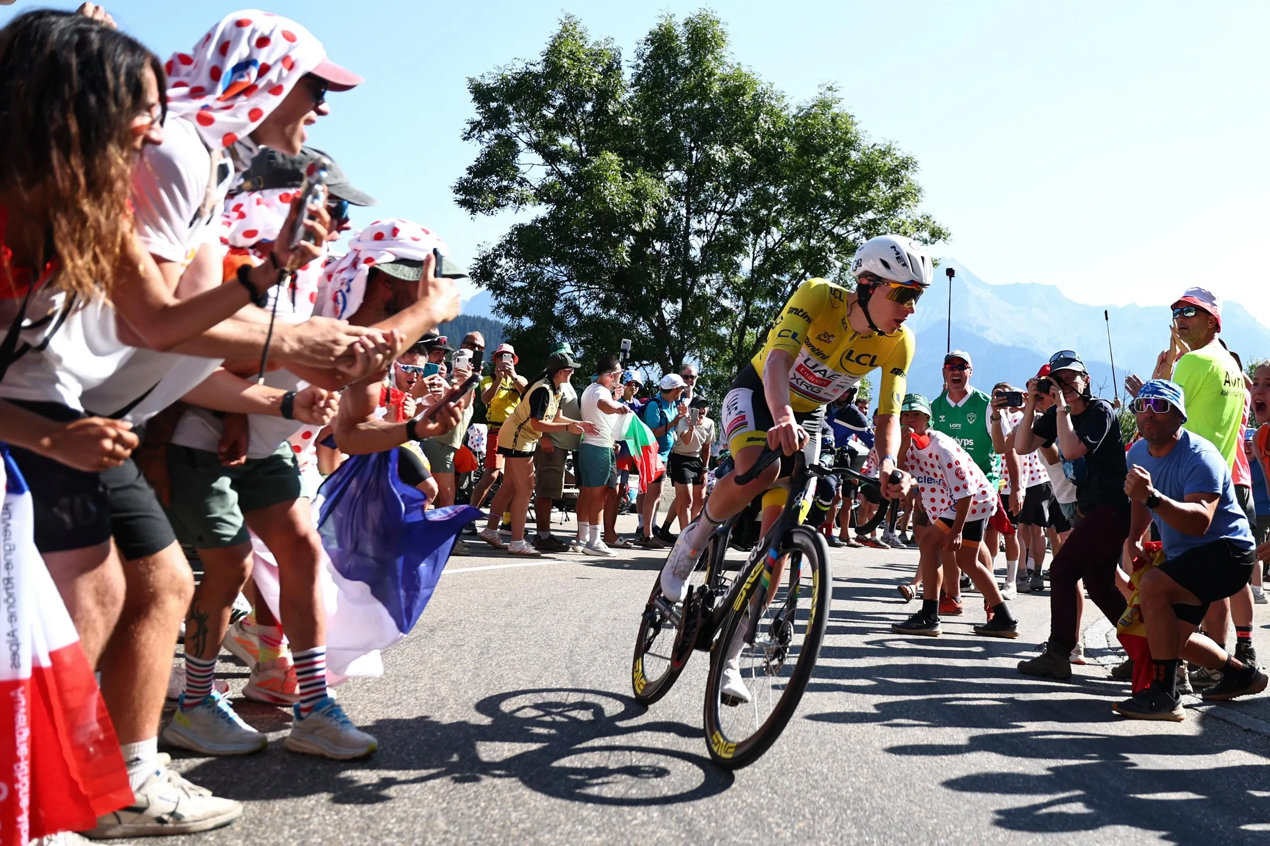 Tadej Pogacar chases down the lead breakaway group on the Alpe d’Huez ascent