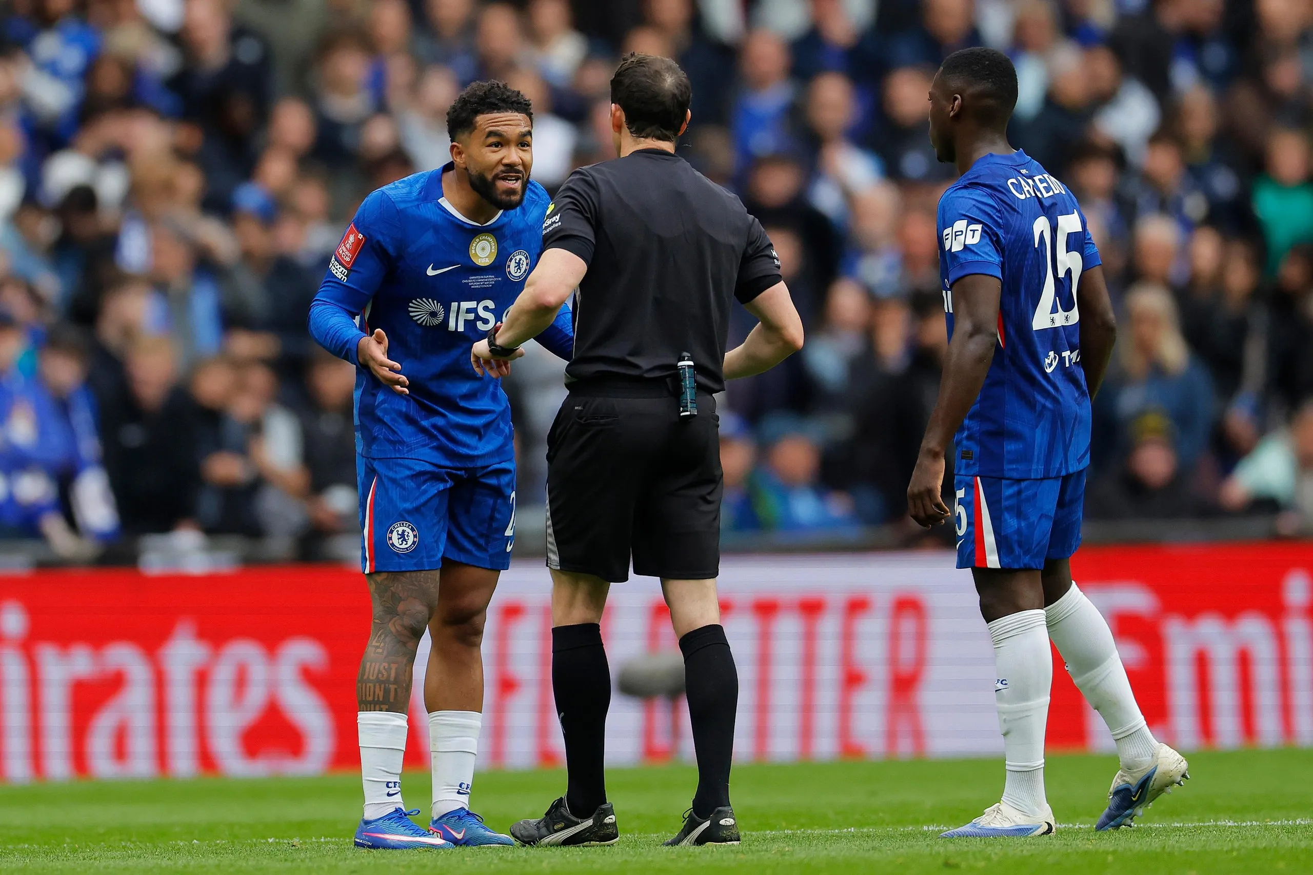 Reece James remonstrates with referee, Darren England, during the FA Cup final.