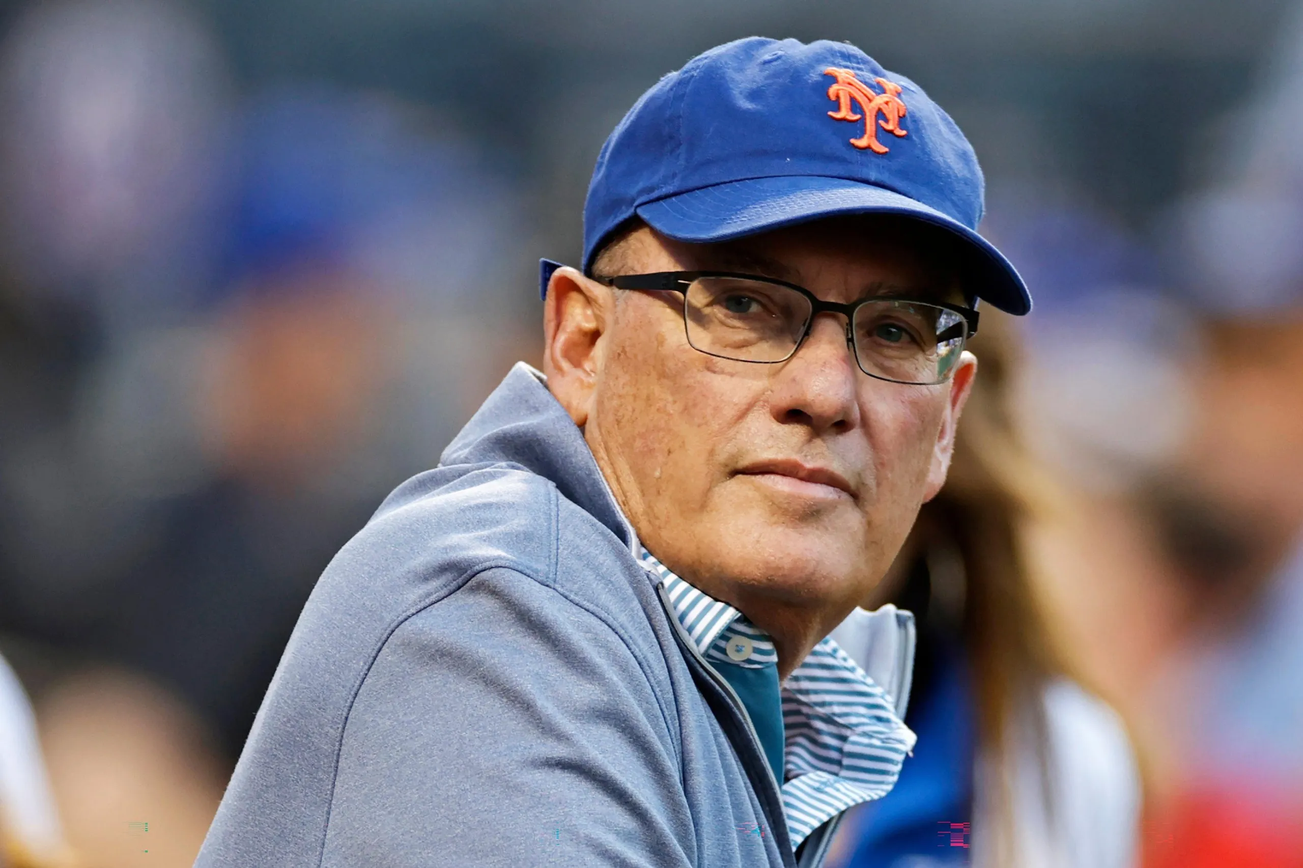 A man in a NY Mets cap