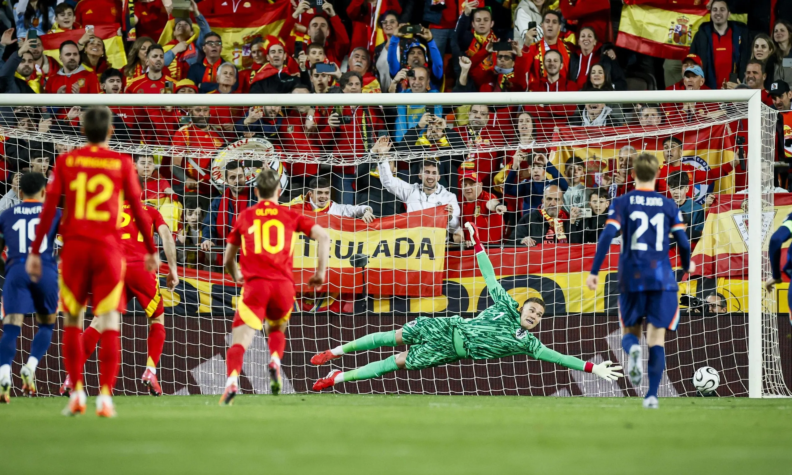 Mikel Oyarzabal of Spain scores the 1-0 behind goalkeeper Bart Verbruggen.