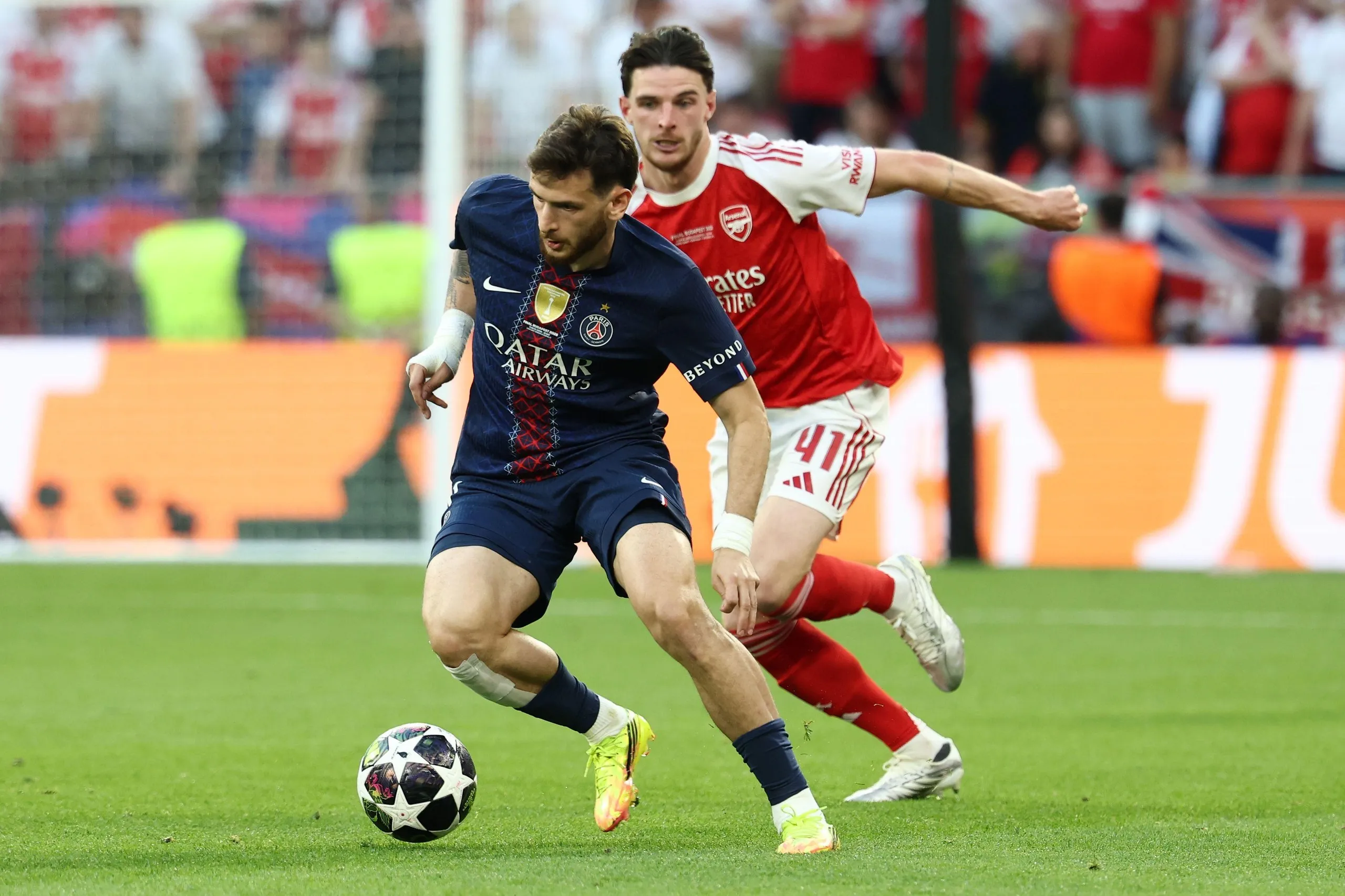 Khvicha Kvaratskhelia of PSG and Declan Rice of Arsenal compete for the ball during the 2025/2026 Champions League Final football match between Paris Saint Germain and Arsenal FC at Puskas Arena stadium in Budapest (Hungary), May 30th, 2026.