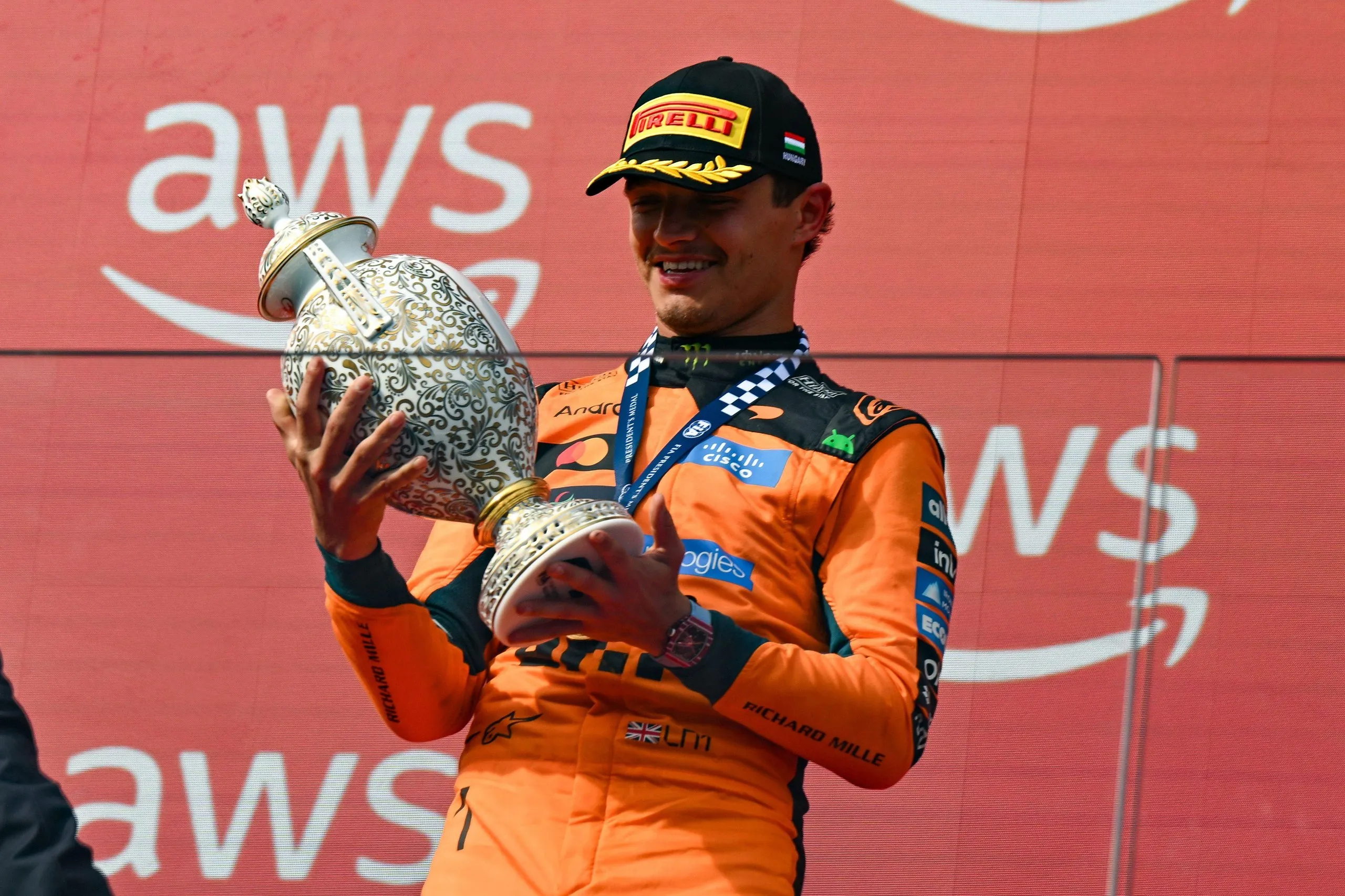 Lando Norris with his trophy after winning the Hungarian Grand Prix.