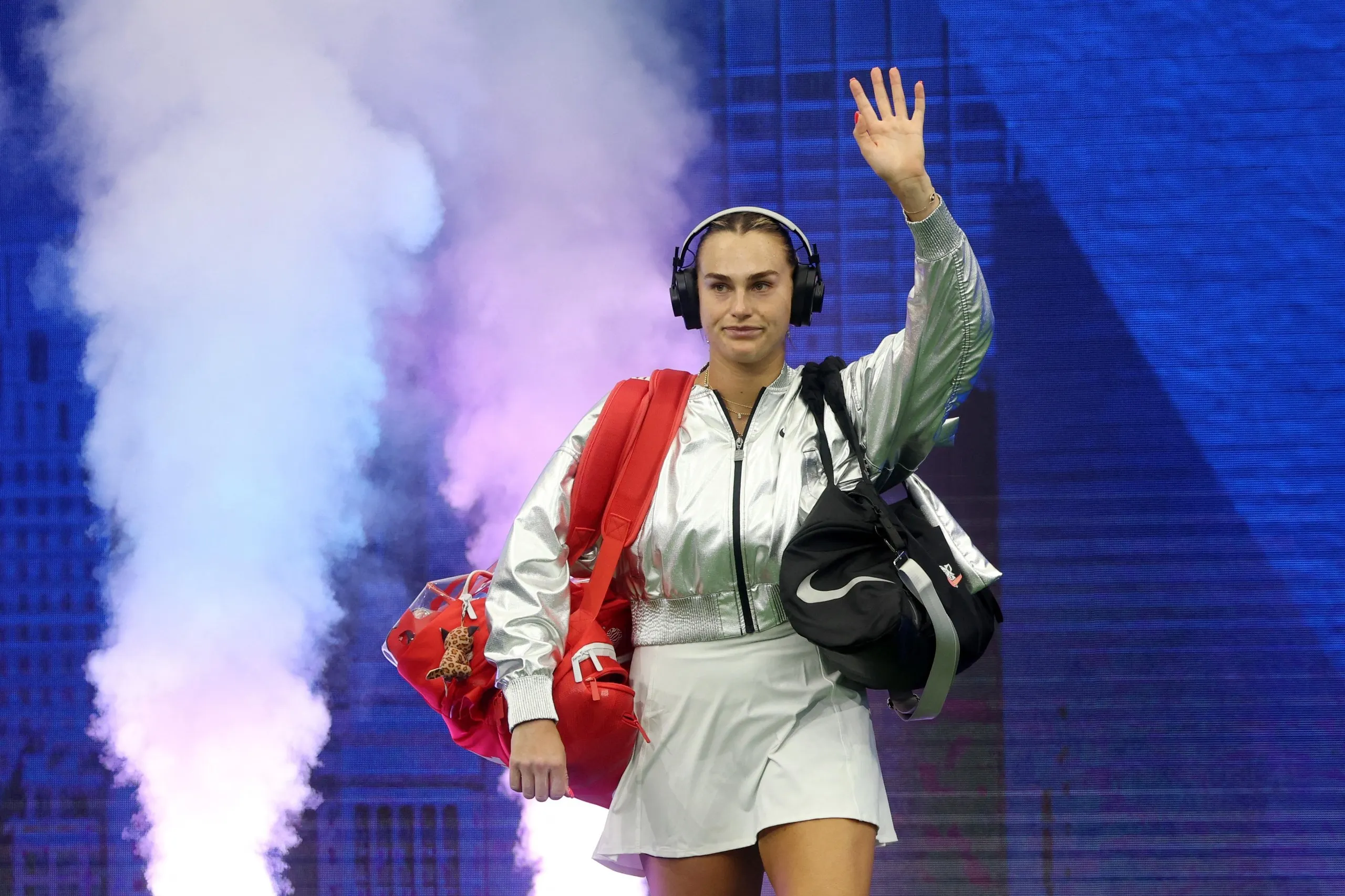 Aryna Sabalenka walks onto the court