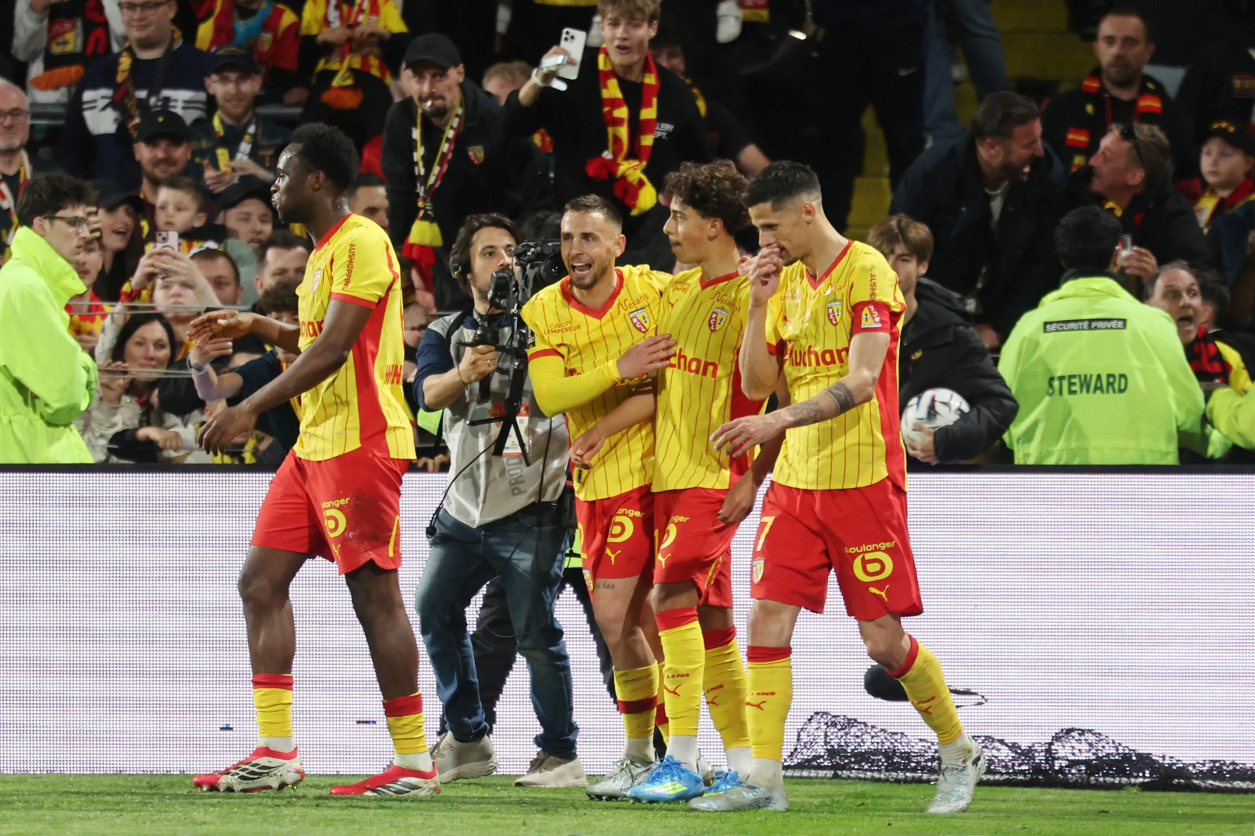 Mezian Mesloub is congratulated by teammates after scoring for Lens against Nantes