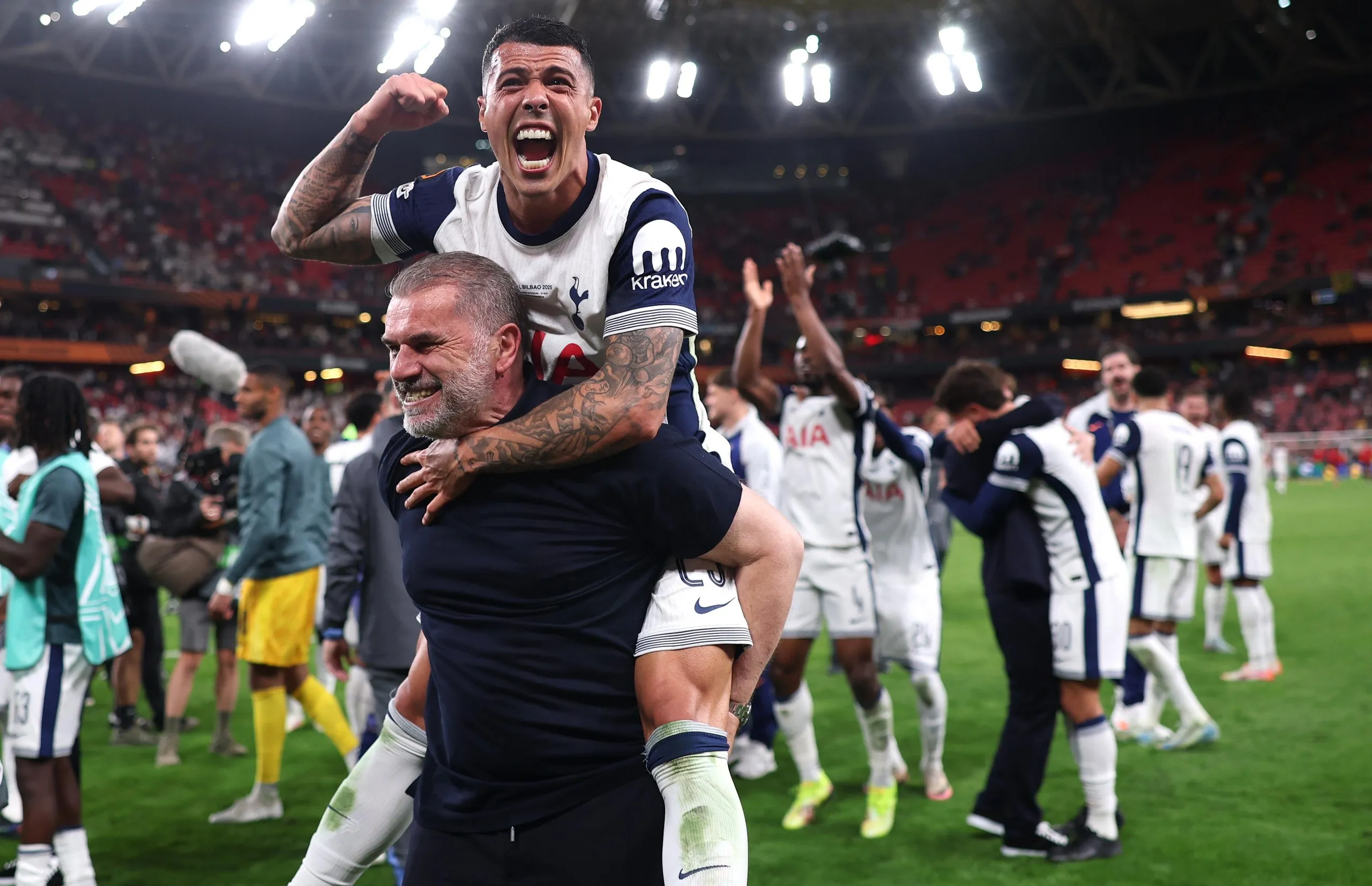Ange Postecoglou gives Porro a piggyback at San Mamés after their Europa League triumph