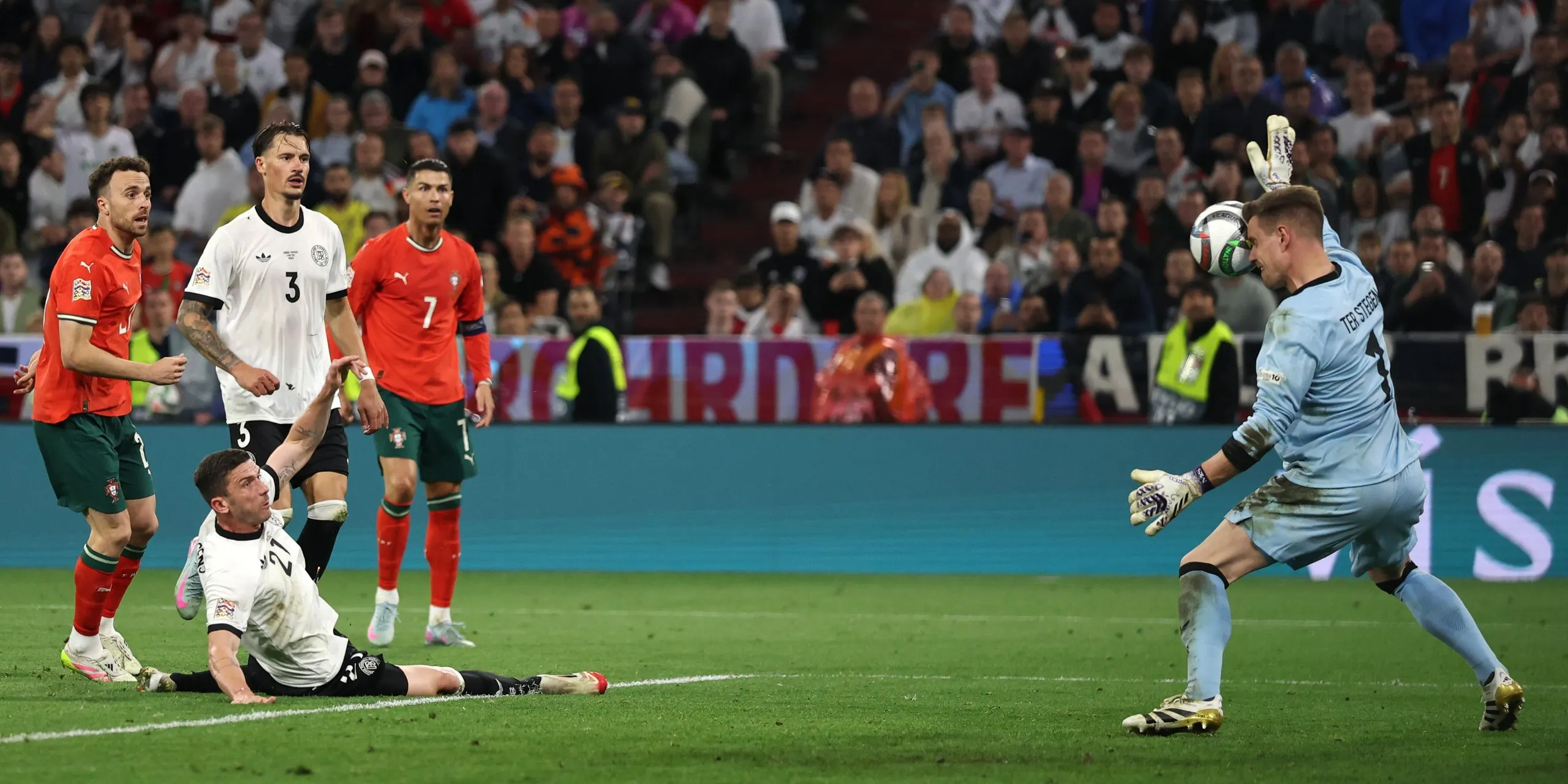 Diogo Jota of Portugal shoots, which is saved by Germany's goalkeeper Marc-Andre ter Stegen.