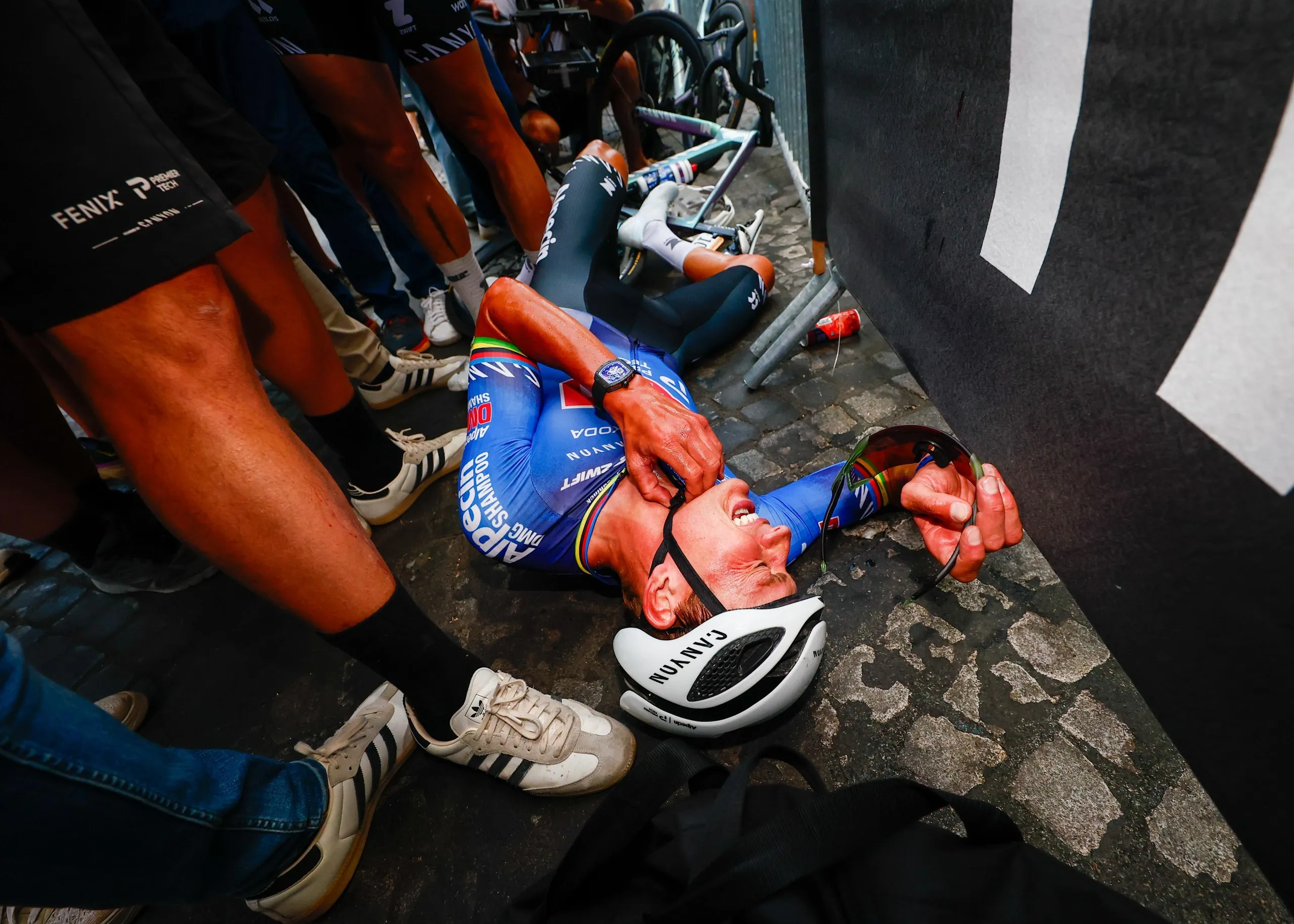 Mathieu van der Poel collapsed after his all out effort to win the final stage on the Champs-Élysées.