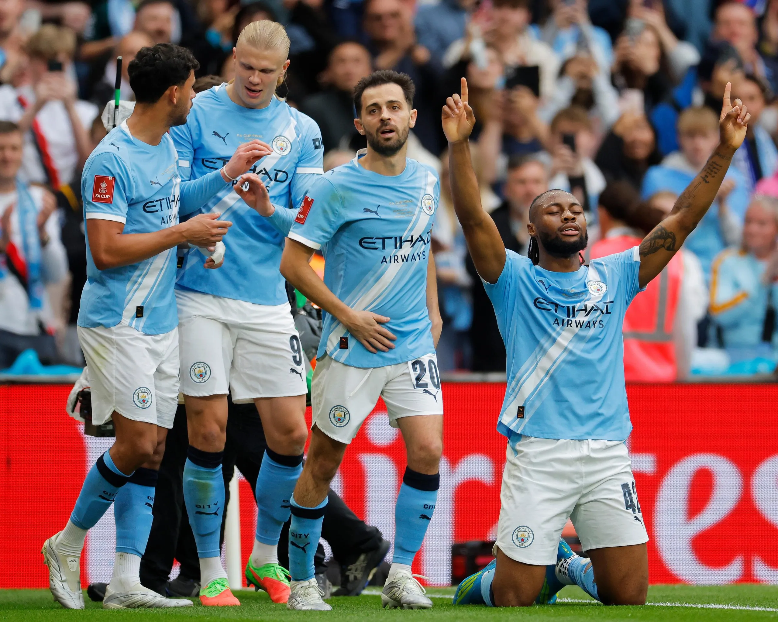 Manchester City’s Antoine Semenyo (right) celebrates after scoring the opening goal with a cheeky backheel.