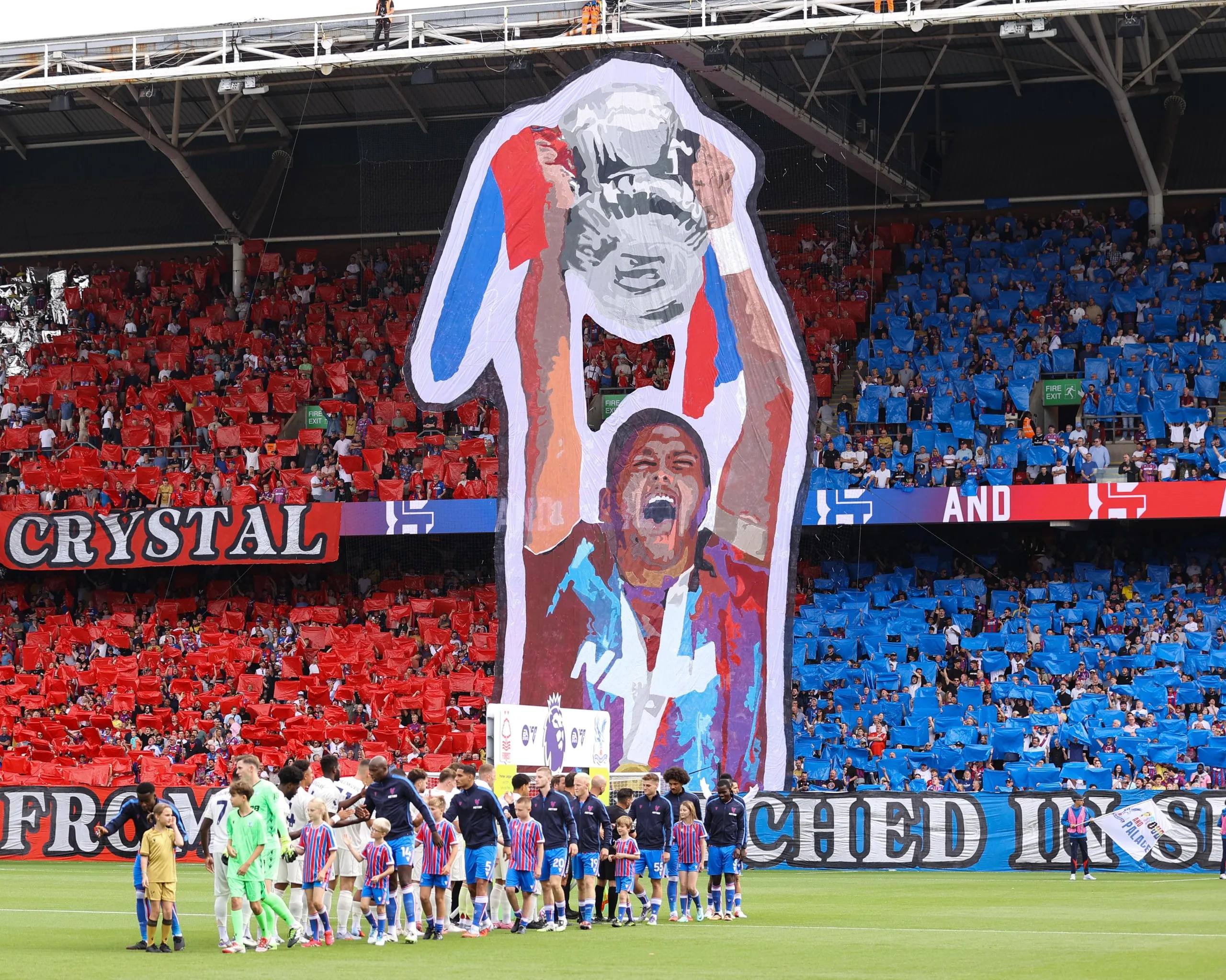 A tifo showing Joel Ward lifting the FA Cup in August 2025.