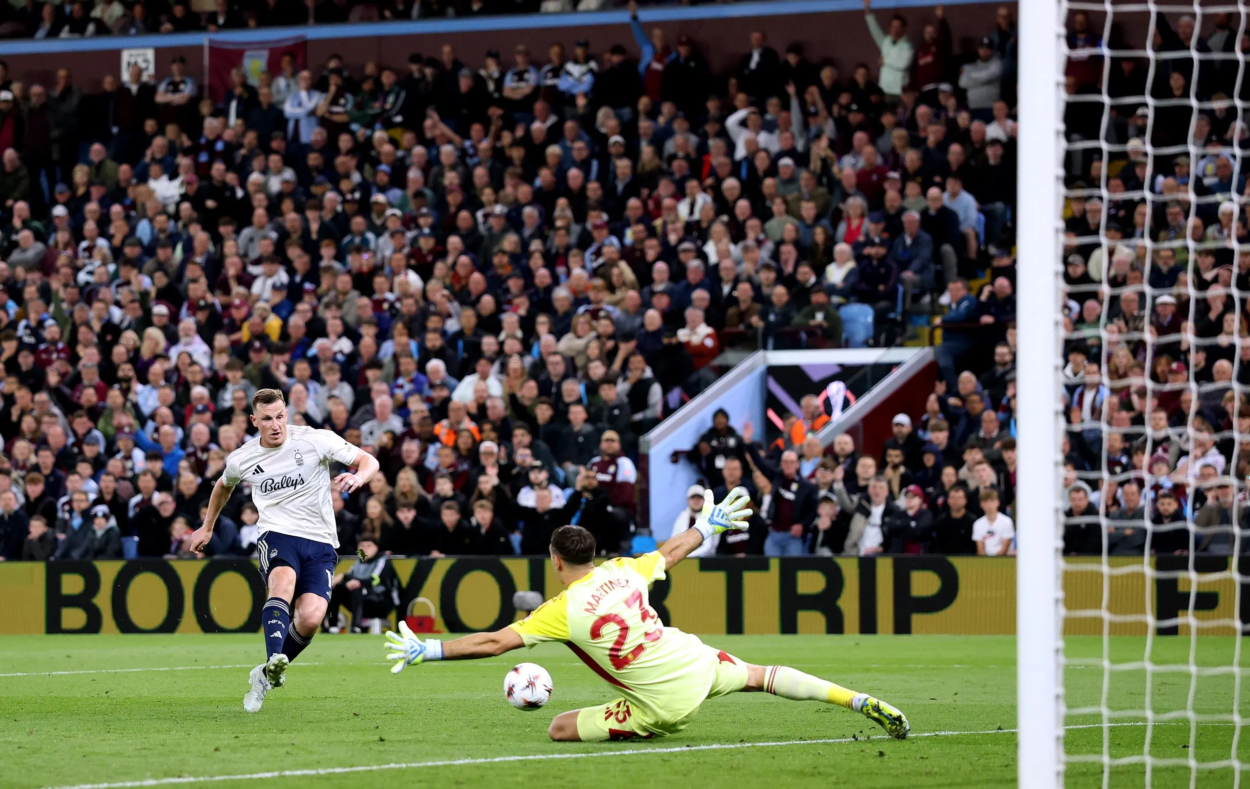 Emi Martinez makes a smart save from Chris Wood.