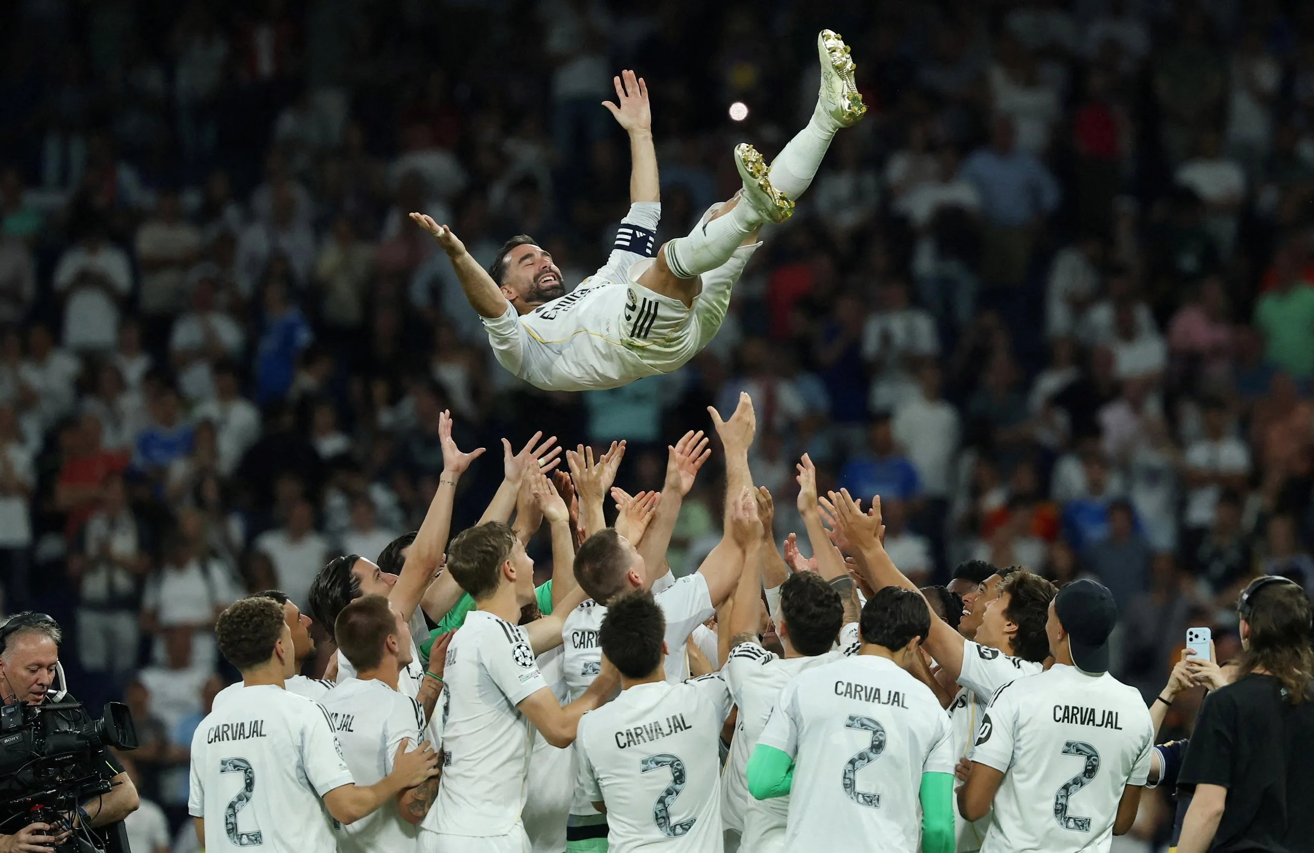 Dani Carvajal is thrown into the air by his teammates after playing his last match for Real Madrid