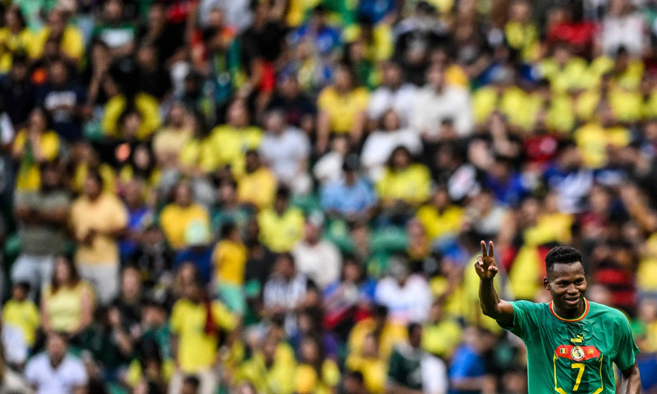Senegal defender Habib Diallo celebrates after scoring against Brazil.