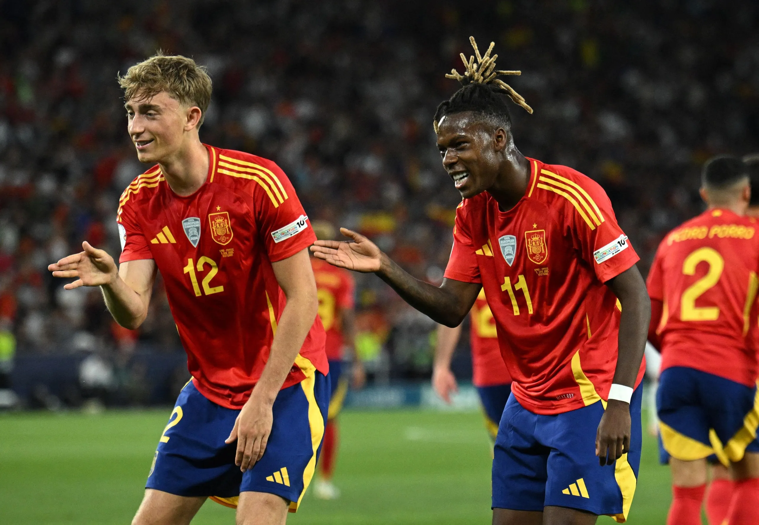 Nico Williams celebrates scoring his first goal by dancing with Dean Huijsen.