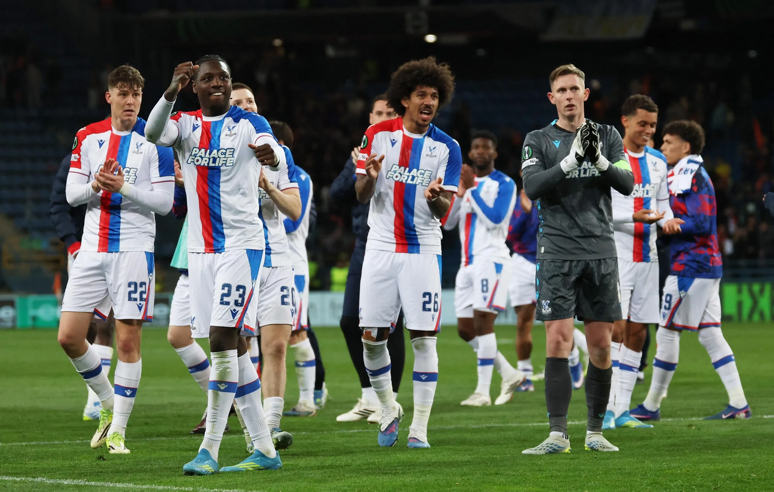 Crystal Palace's Jaydee Canvot, Chris Richards, Dean Henderson and Jorgen Strand Larsen applaud their fans as they celebrate their victory after the final whistle.
