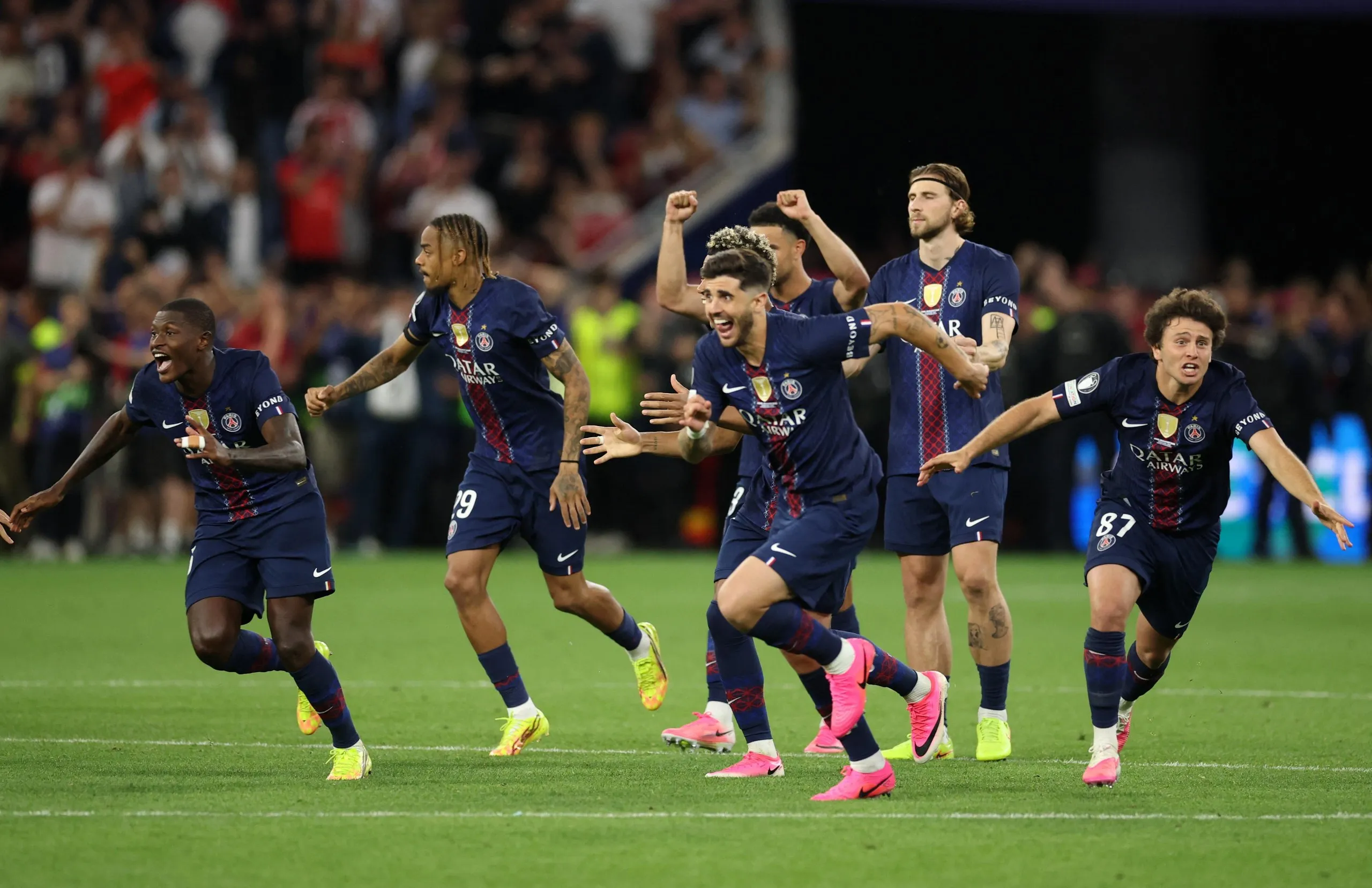 Paris St Germain players celebrate winning the Champions League.
